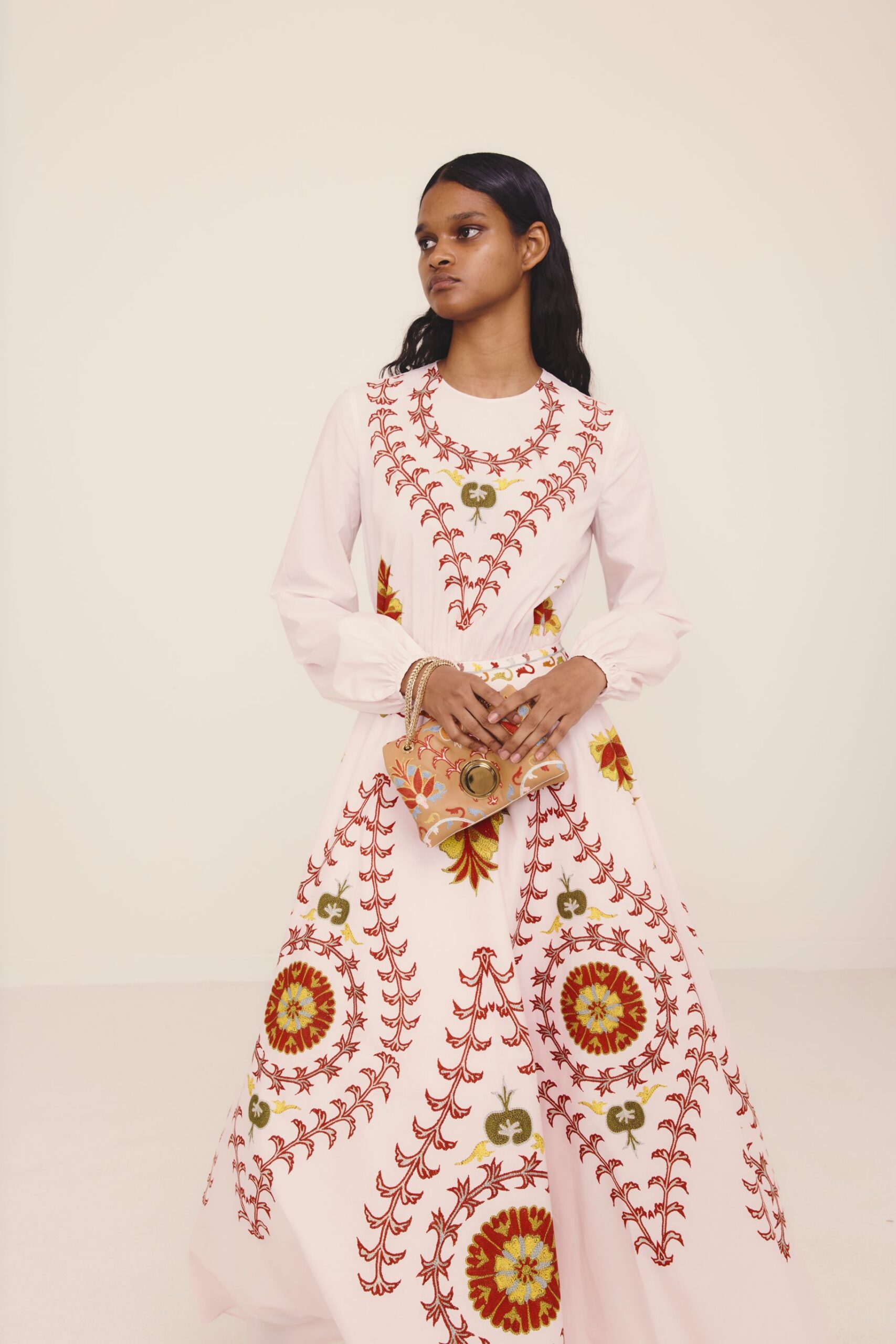white cotton long-sleeve collared fitted embroidered flared gown