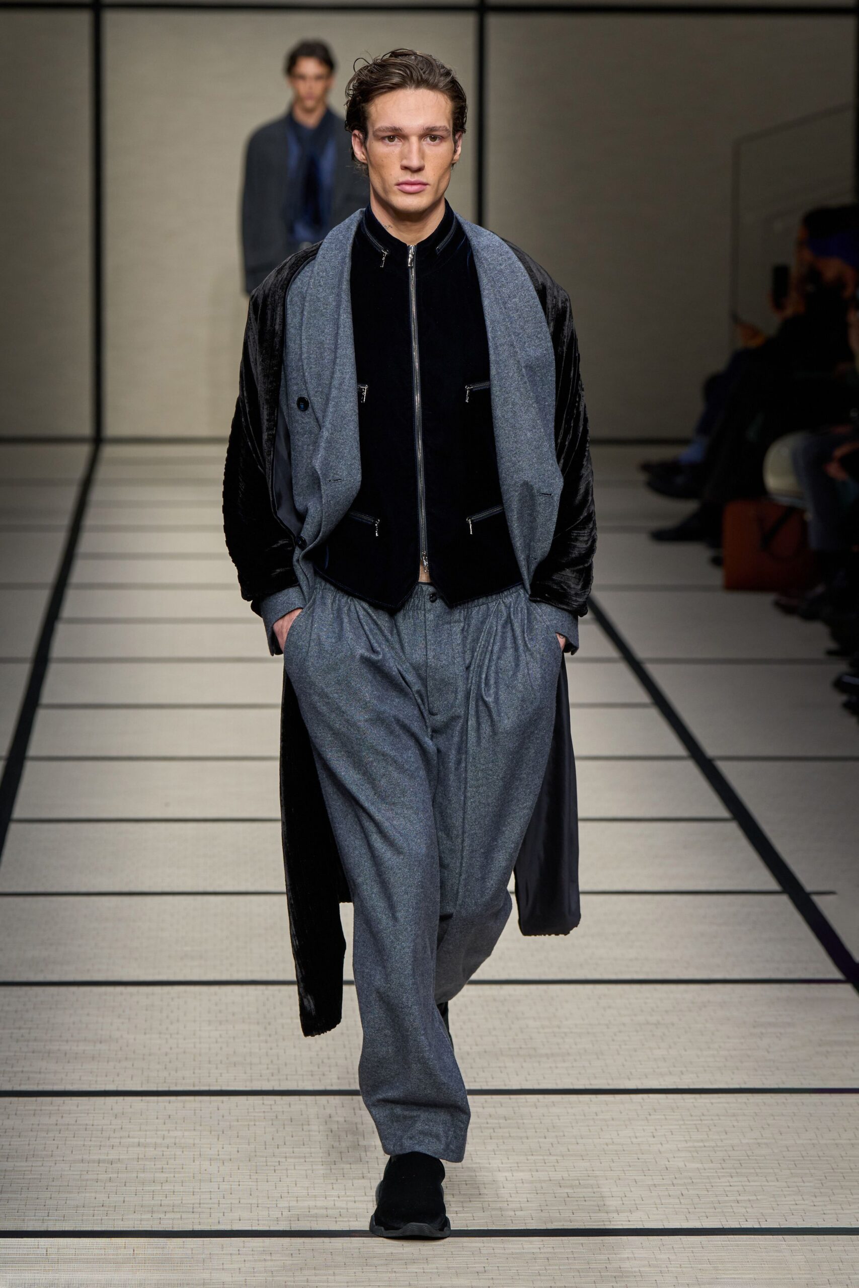 black velvet coat and jacket with gray pants