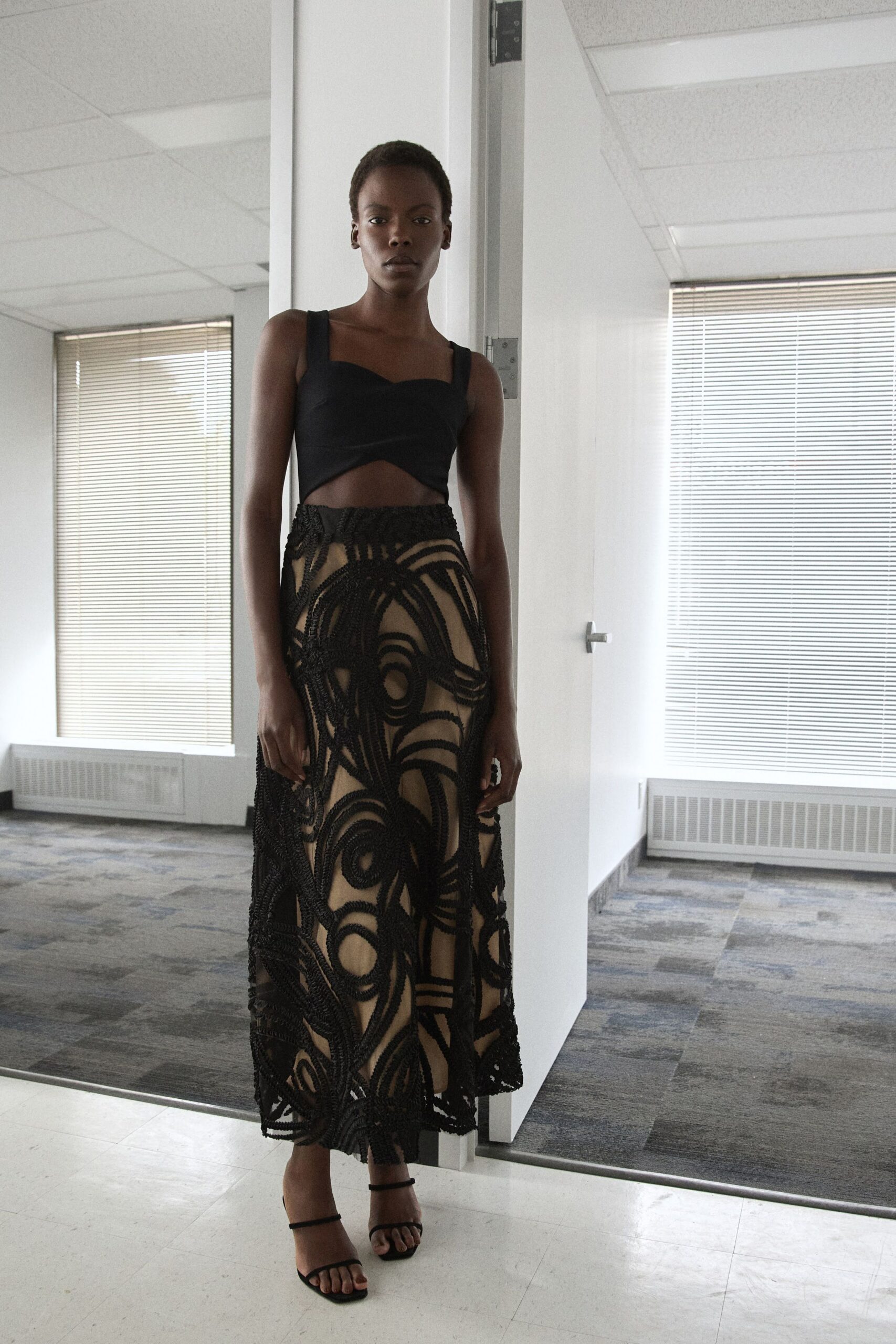 black fitted top and lace maxi skirt