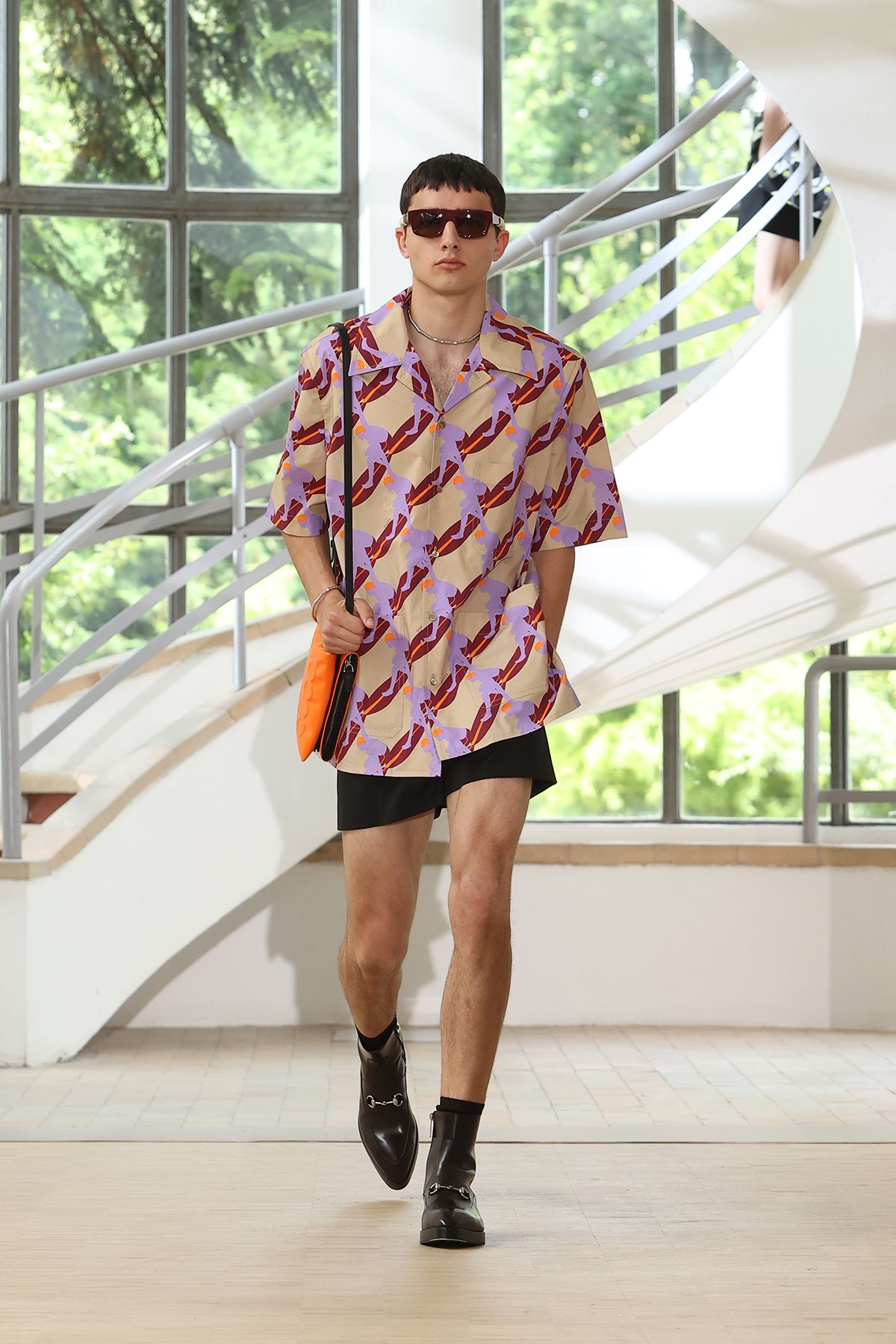 multi-colored printed shirt with black shorts