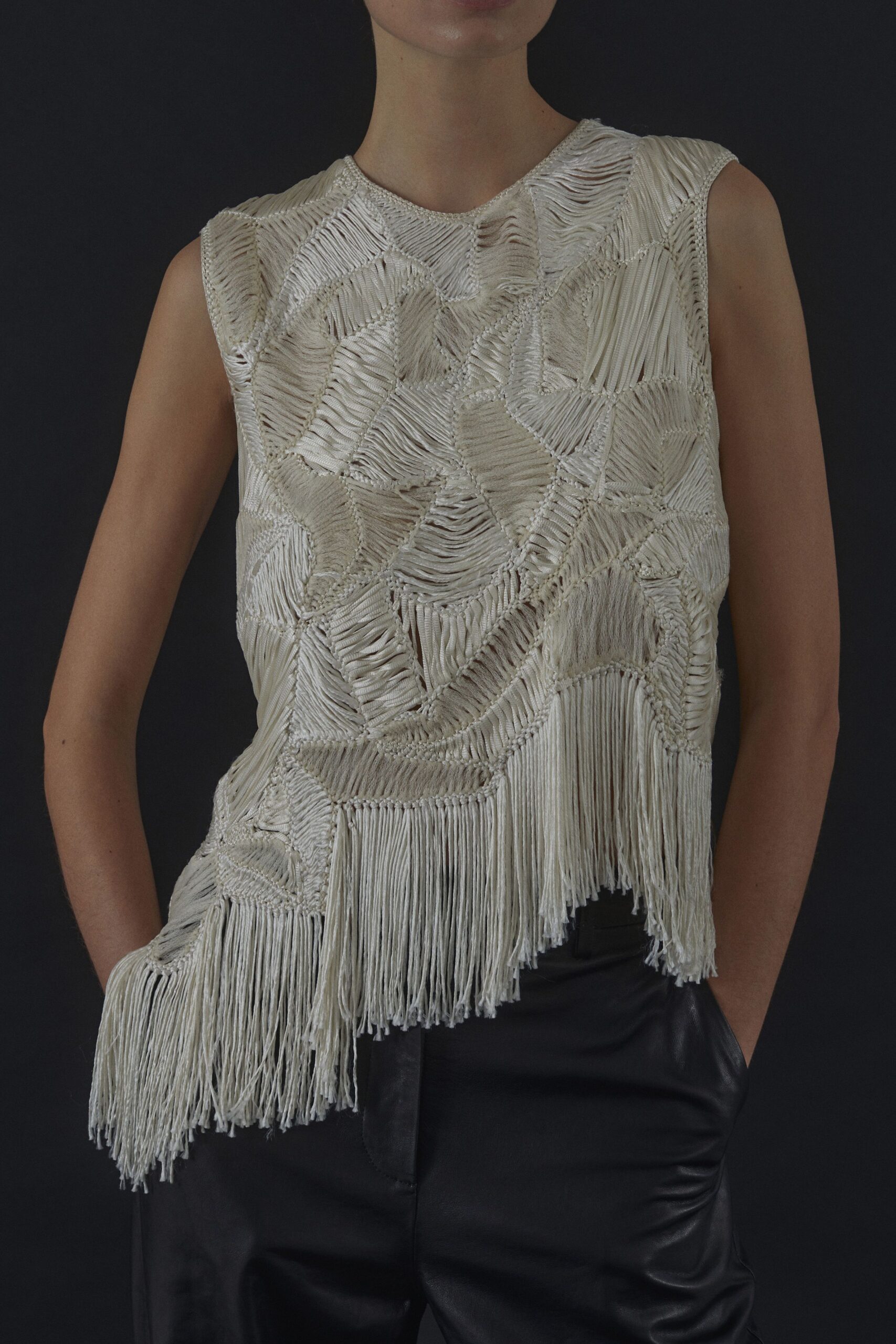 ivory fringed top and black leather pants