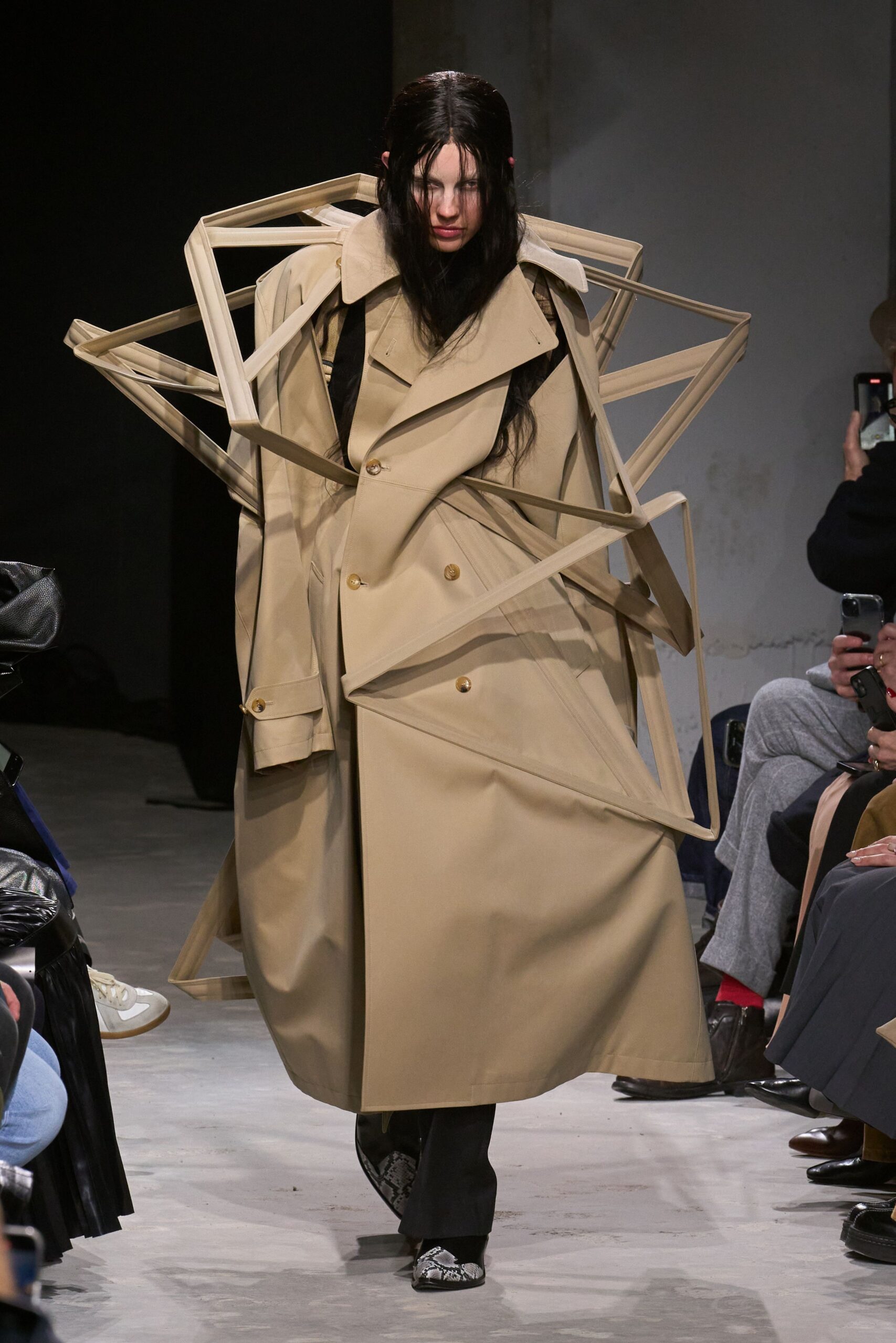 beige trench coat with black pants
