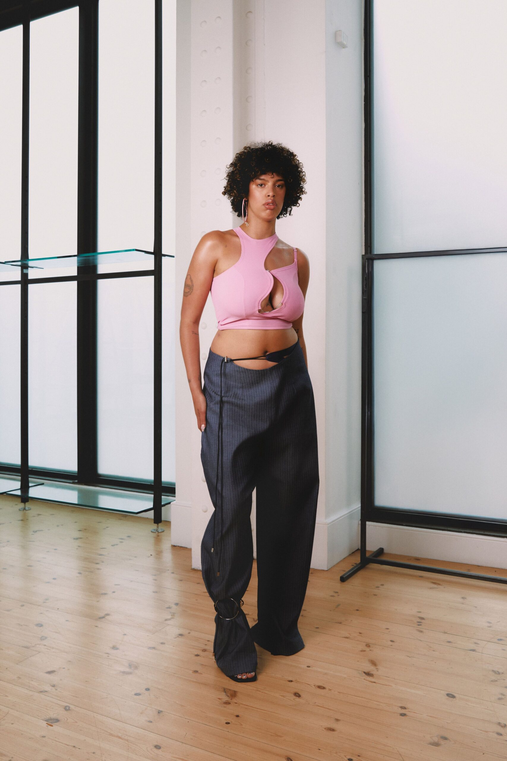 pink fitted top black relaxed pants