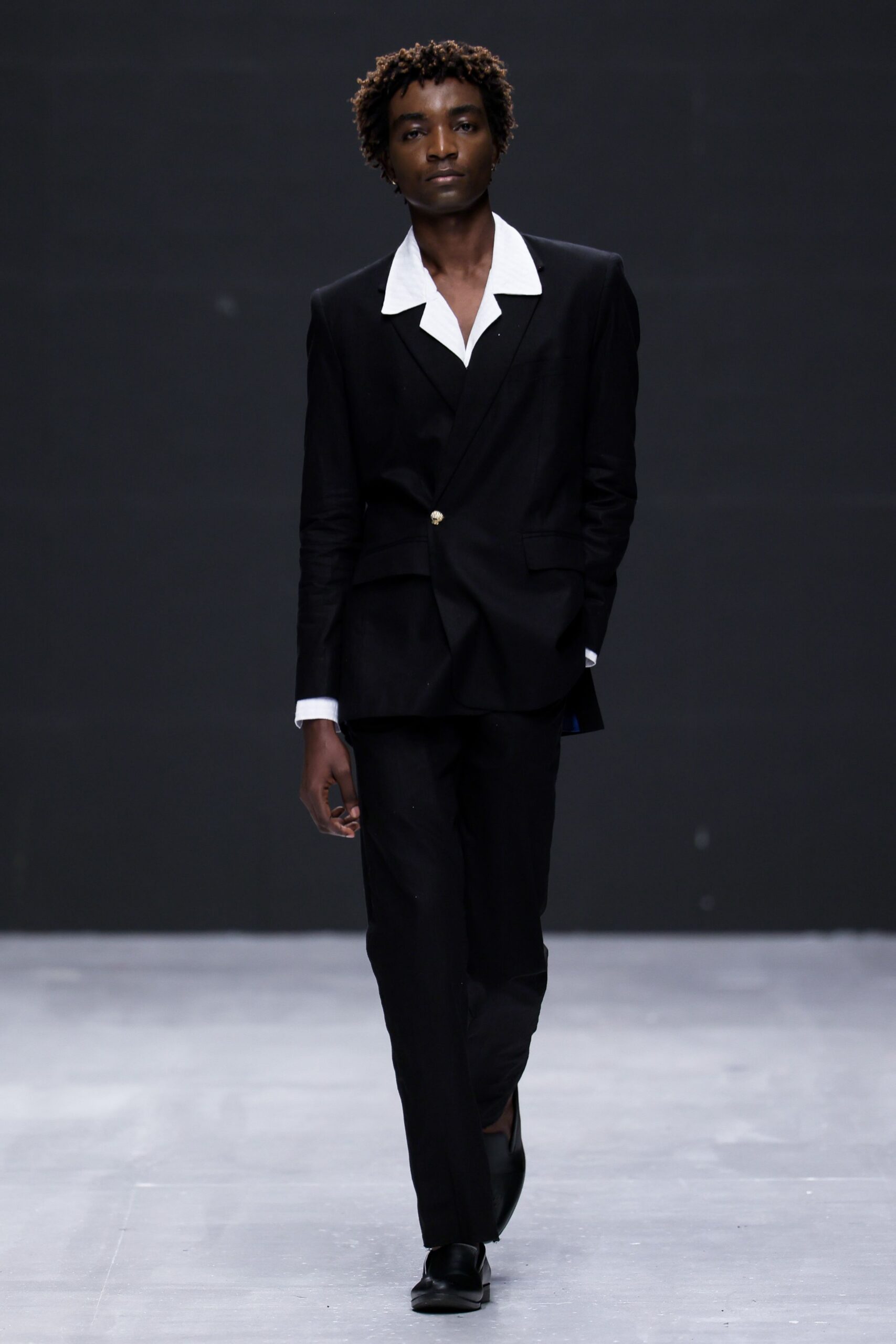 black tailored suit with white shirt