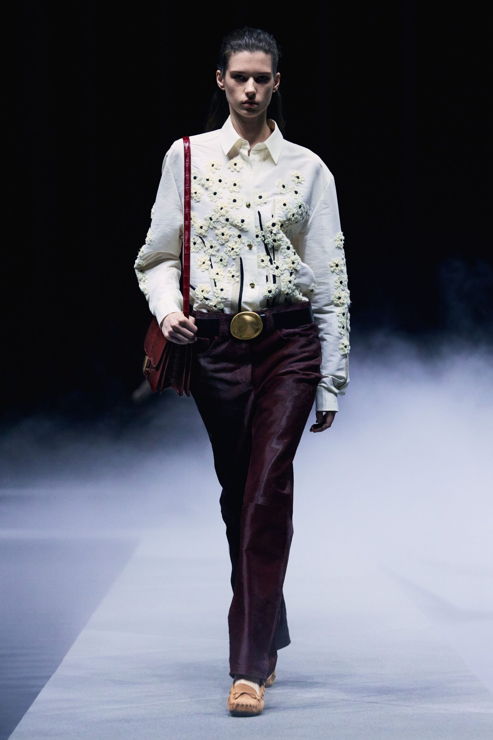 white embroidered shirt with brown pants