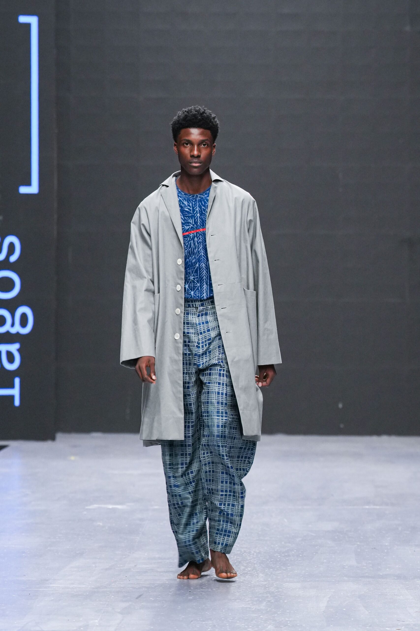 gray coat and blue pants