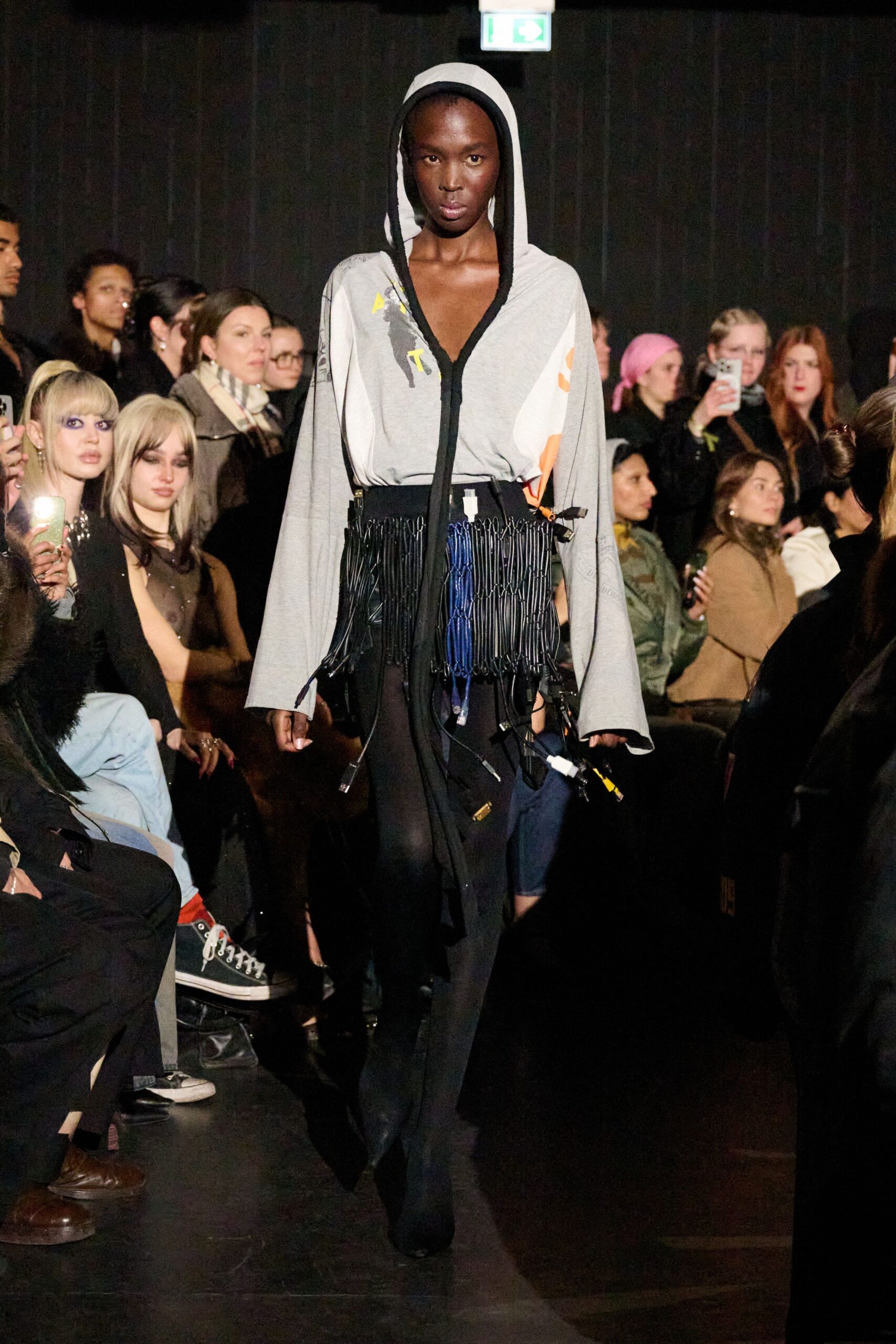 gray hoodie with fringed black skirt