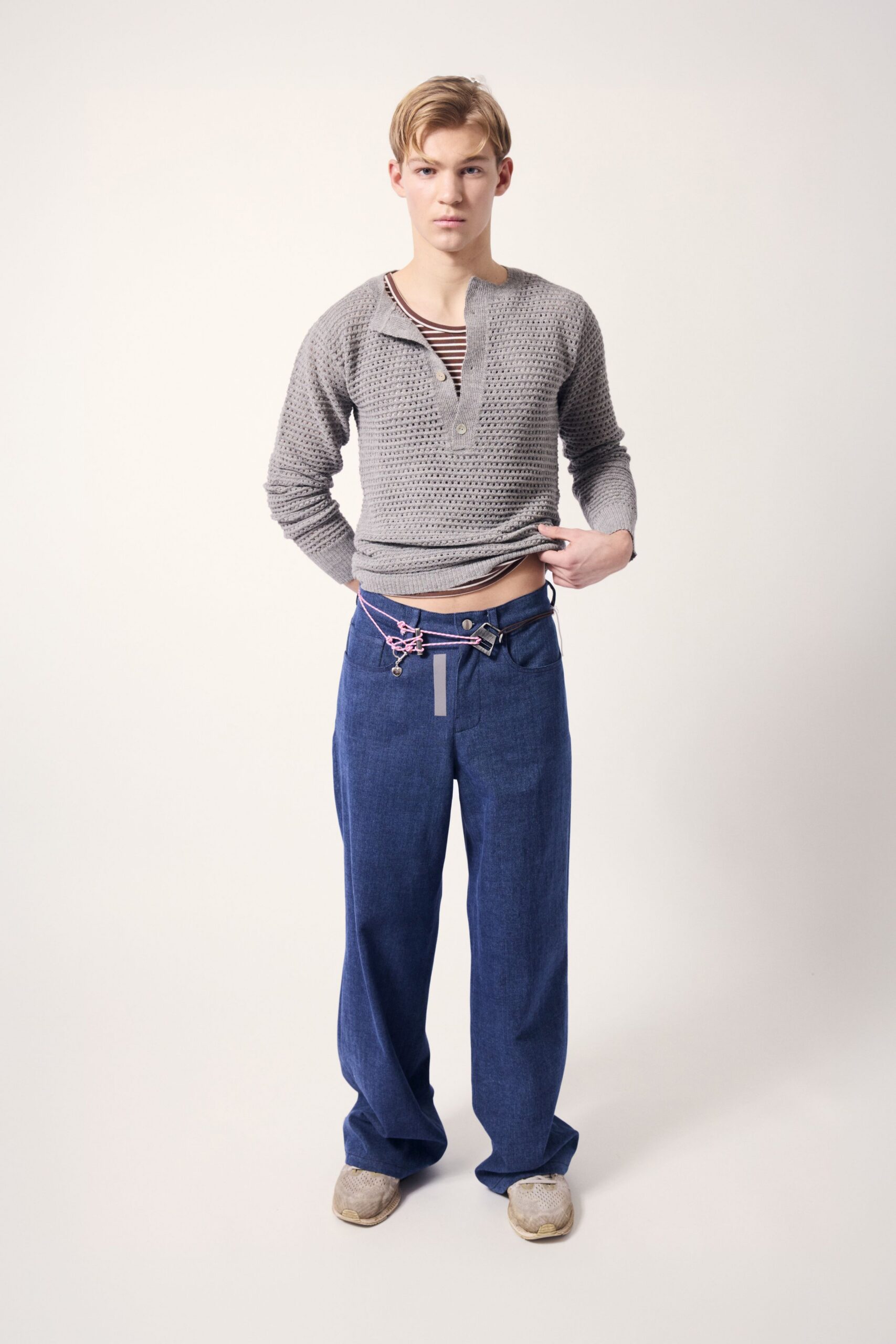 gray fitted sweater with blue pants