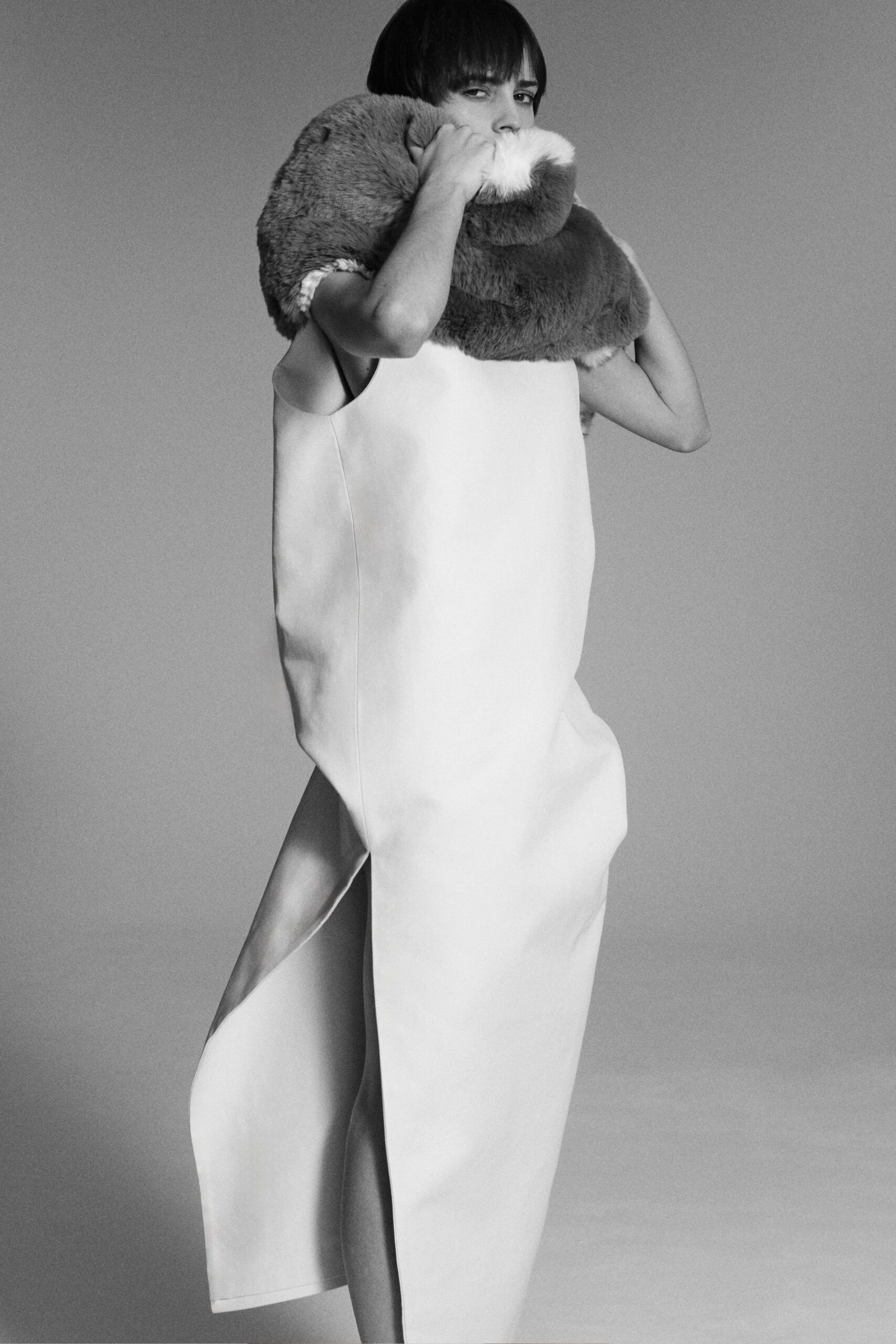 white leather sleeveless high-neck fitted draped maxi dress