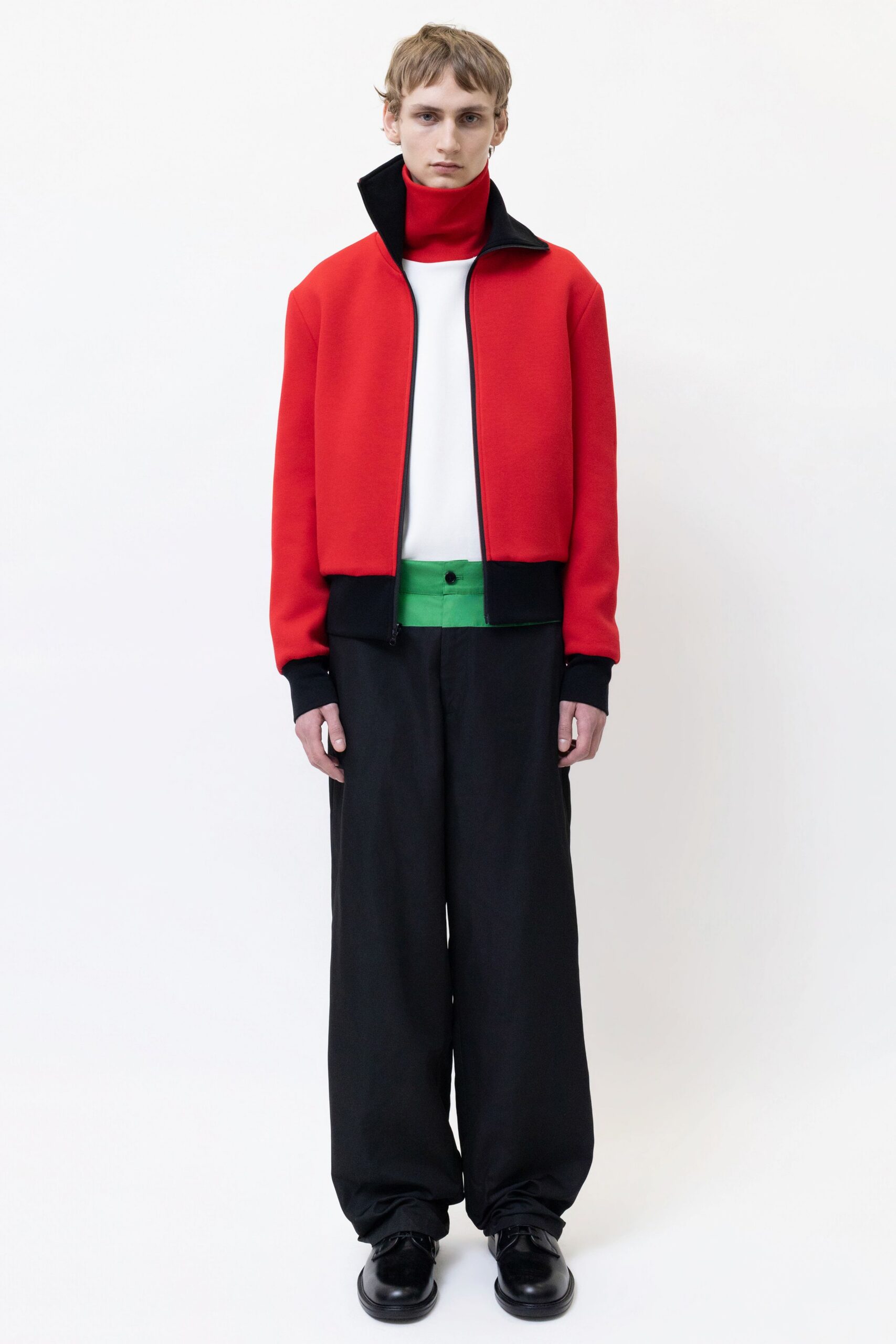 red jacket white shirt black pants