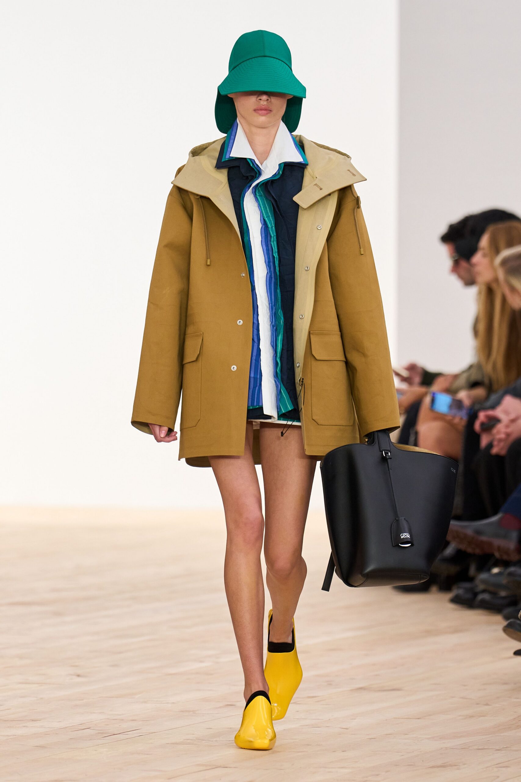 brown coat with multi shirt and shorts