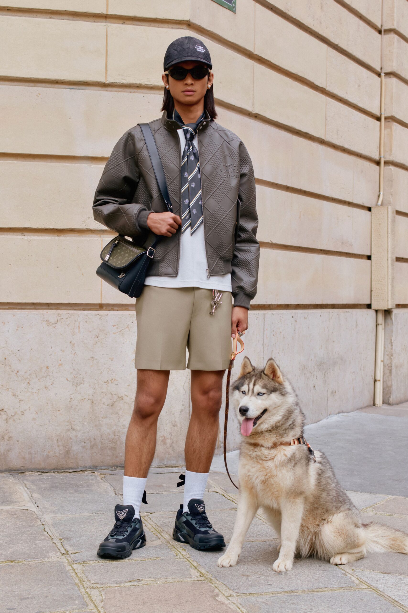 brown leather quilted jacket with beige shorts
