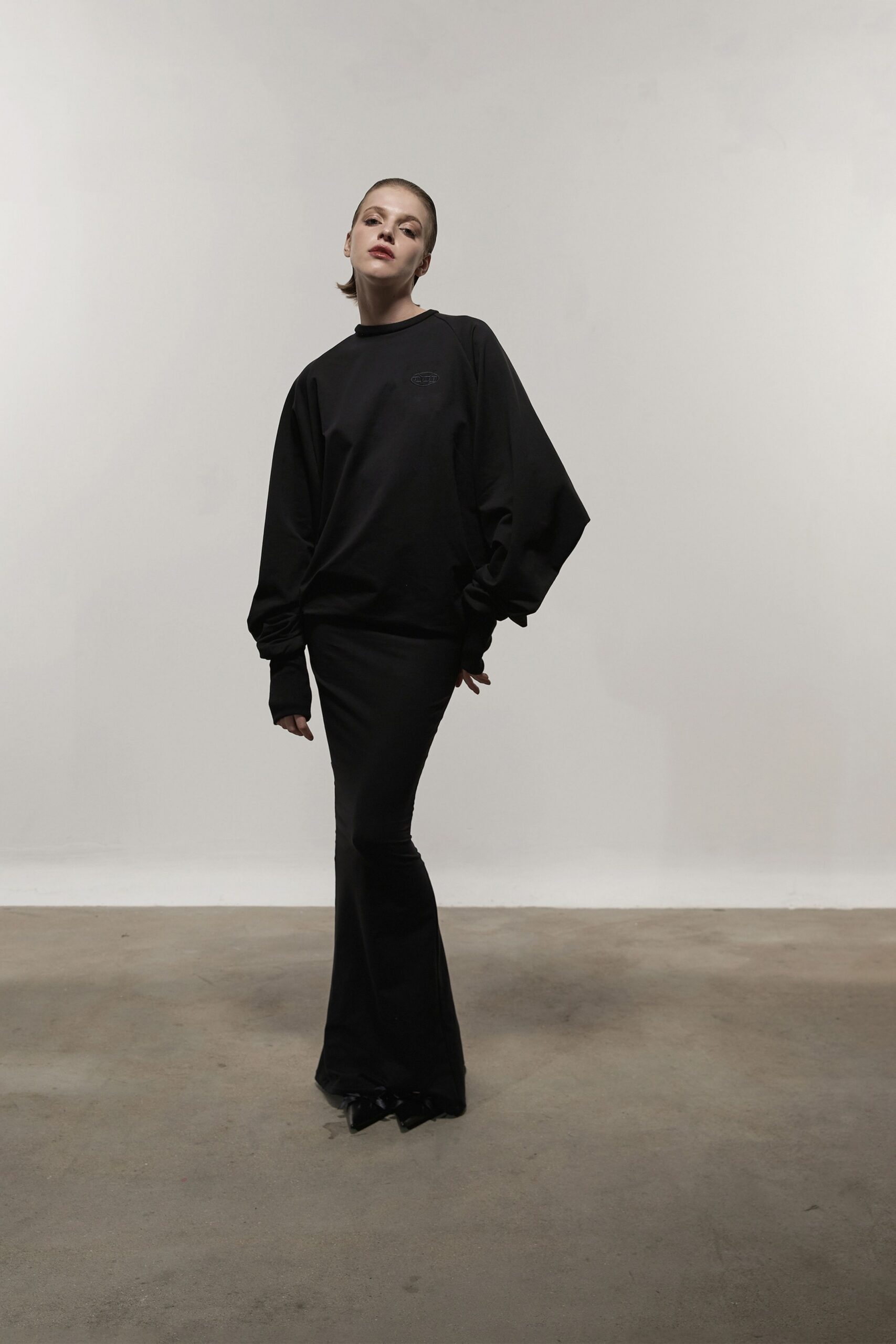 black relaxed top and fitted skirt
