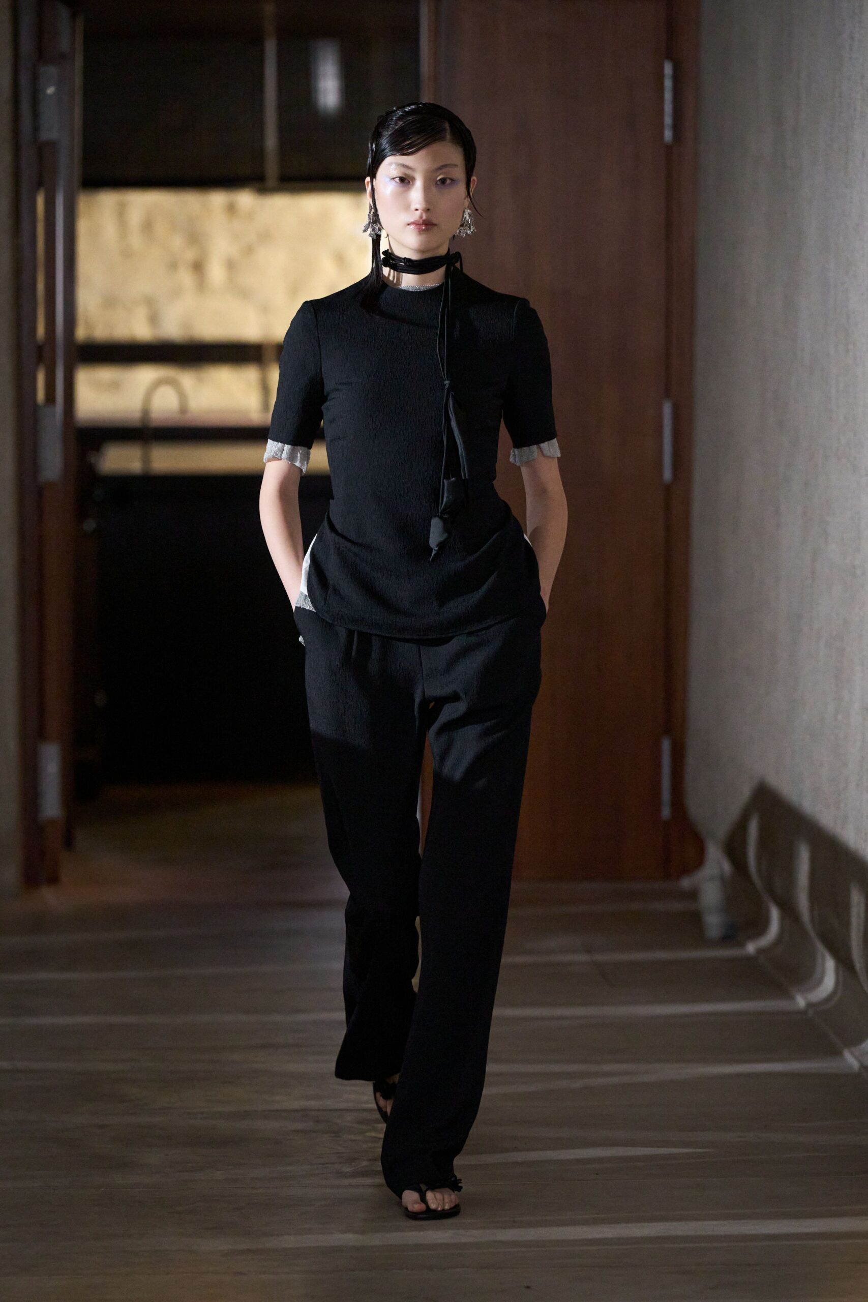 black fitted top and relaxed pants