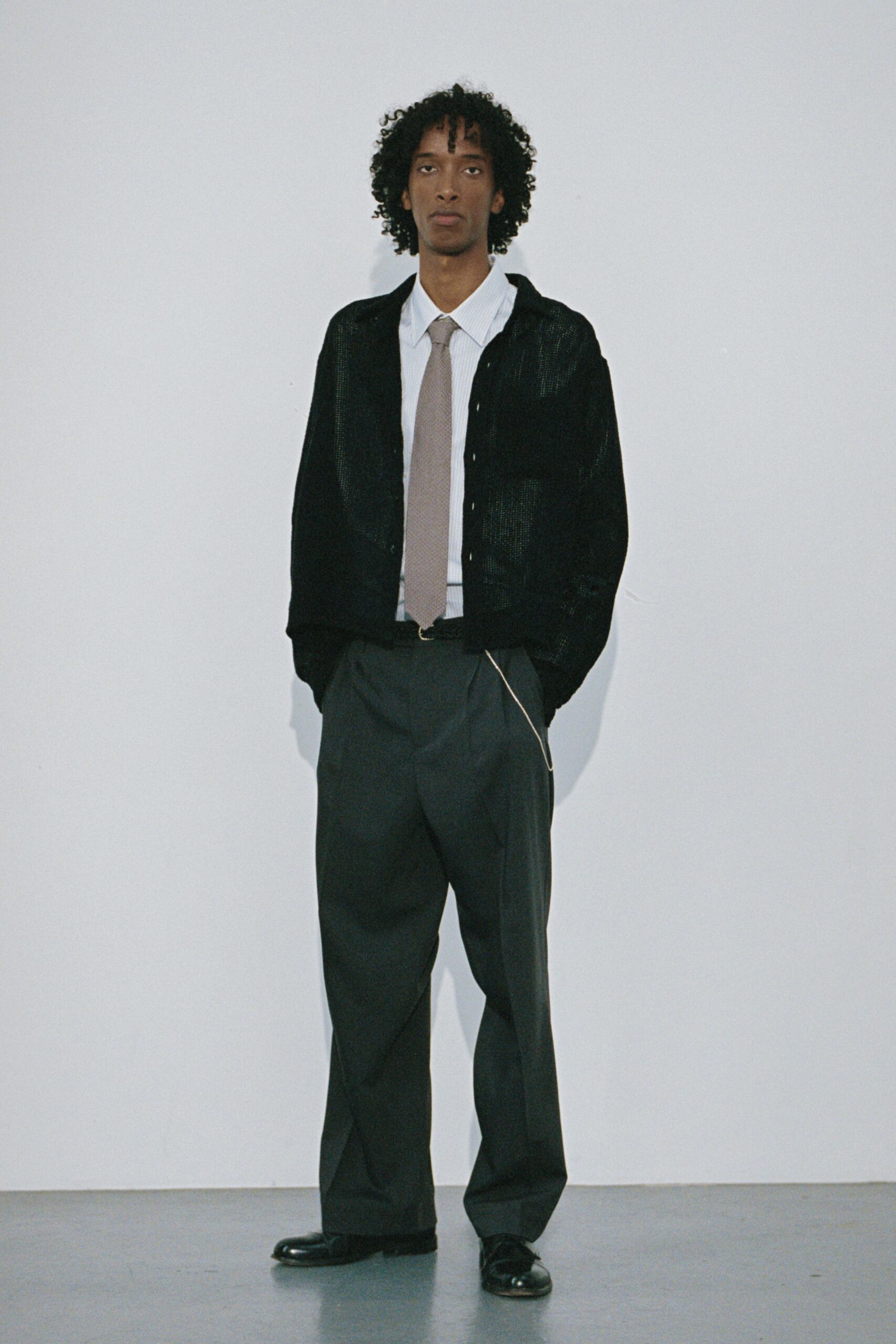 black relaxed jacket with gray pants
