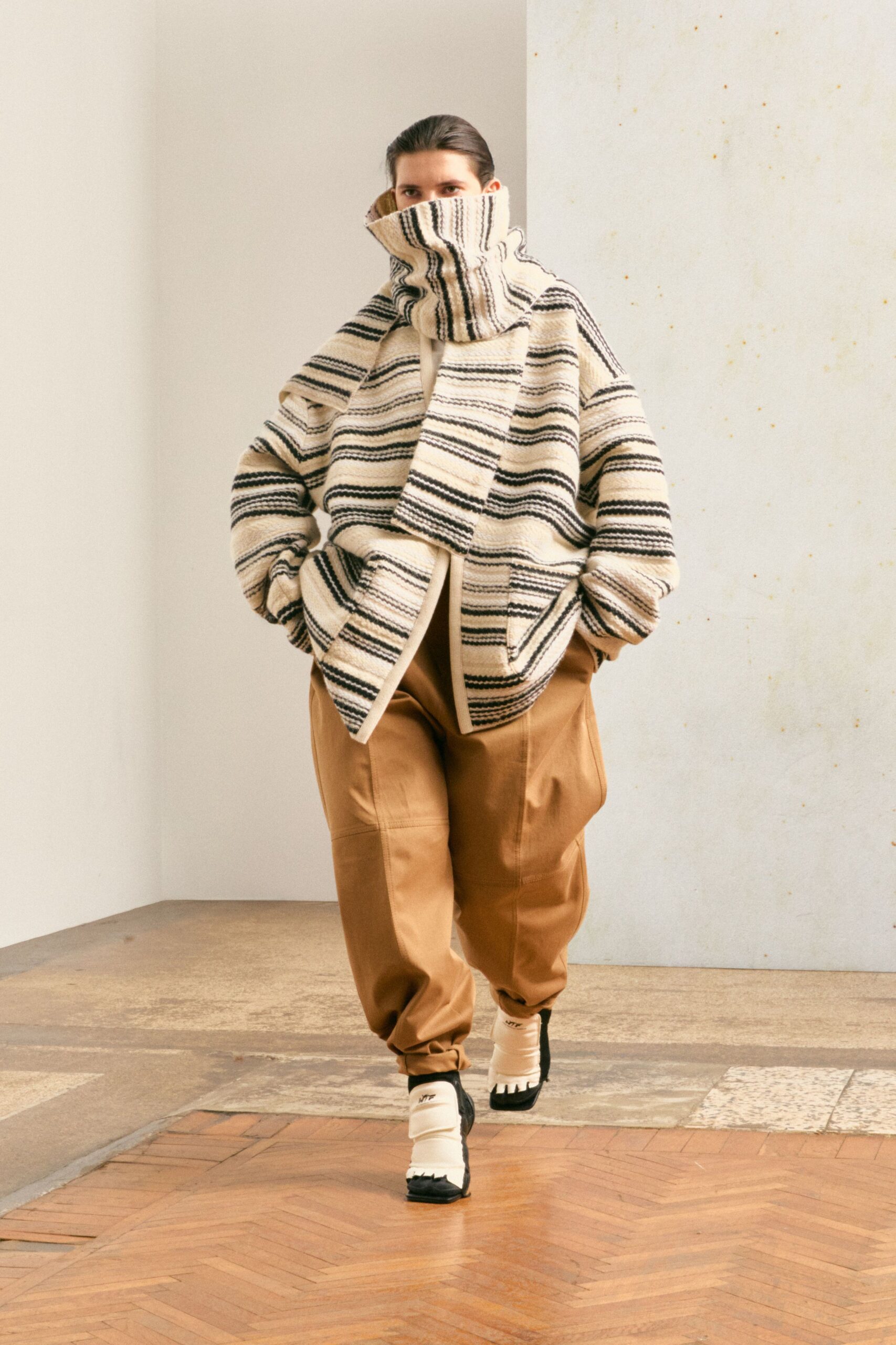 beige striped oversized jacket with relaxed brown pants