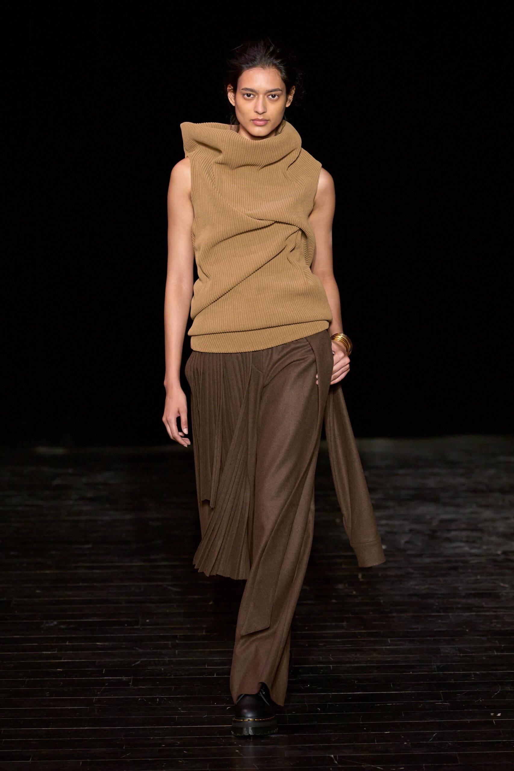 brown fitted top with pleated pants