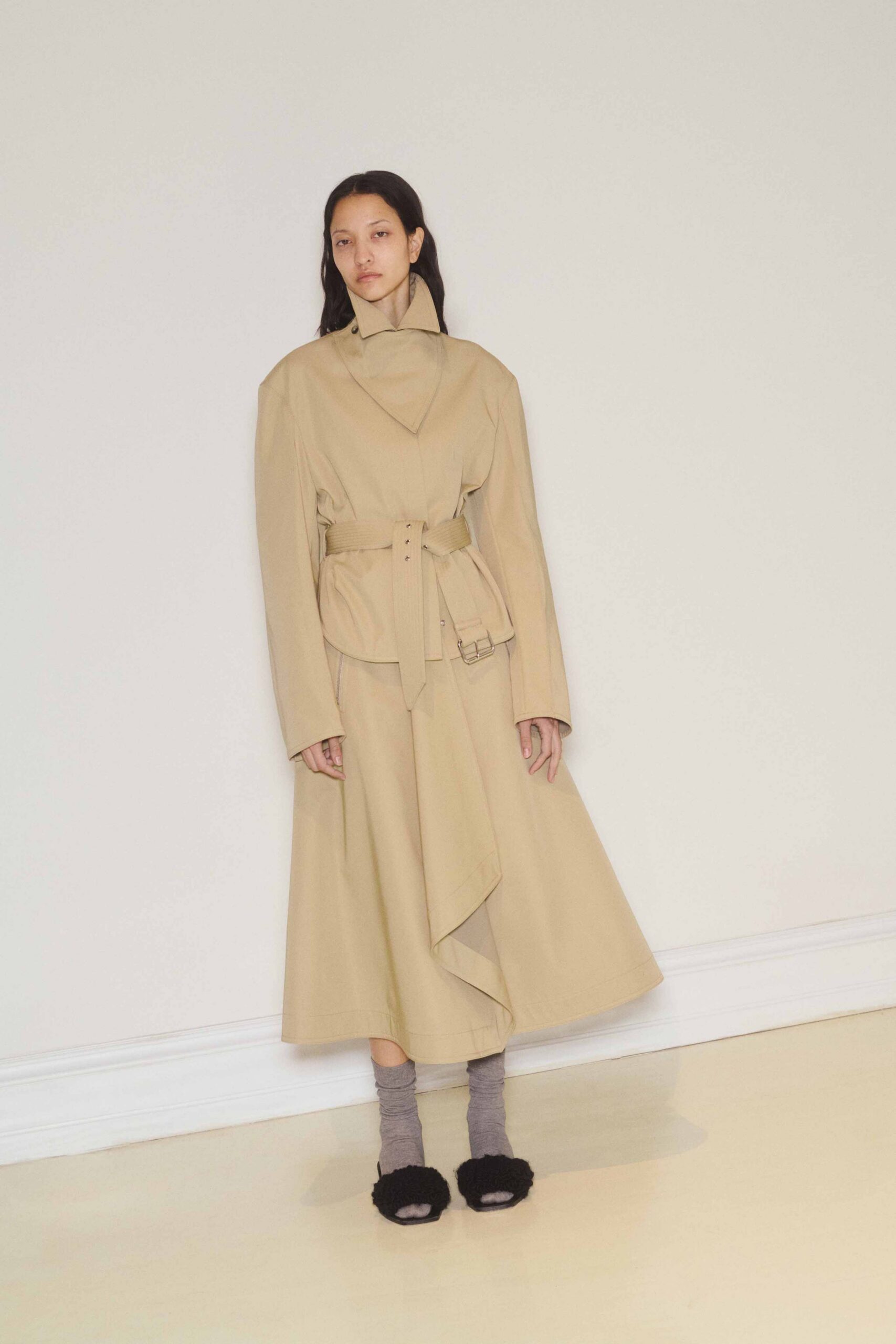 beige belted coat with black shoes