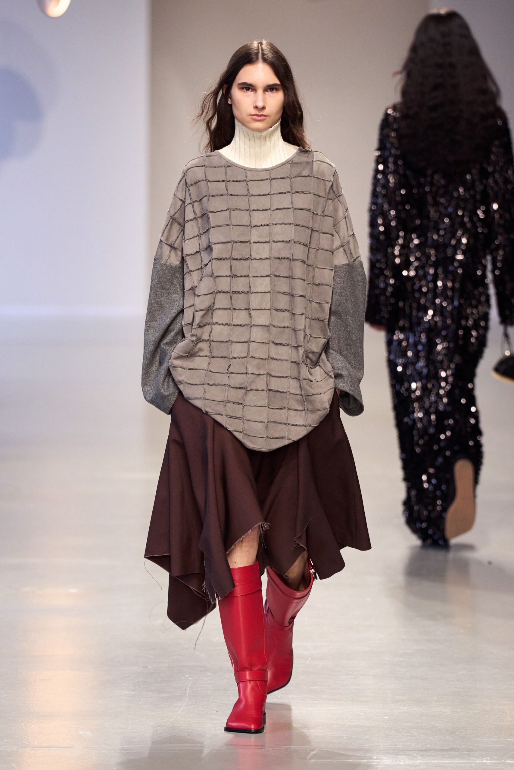 gray top brown skirt red boots