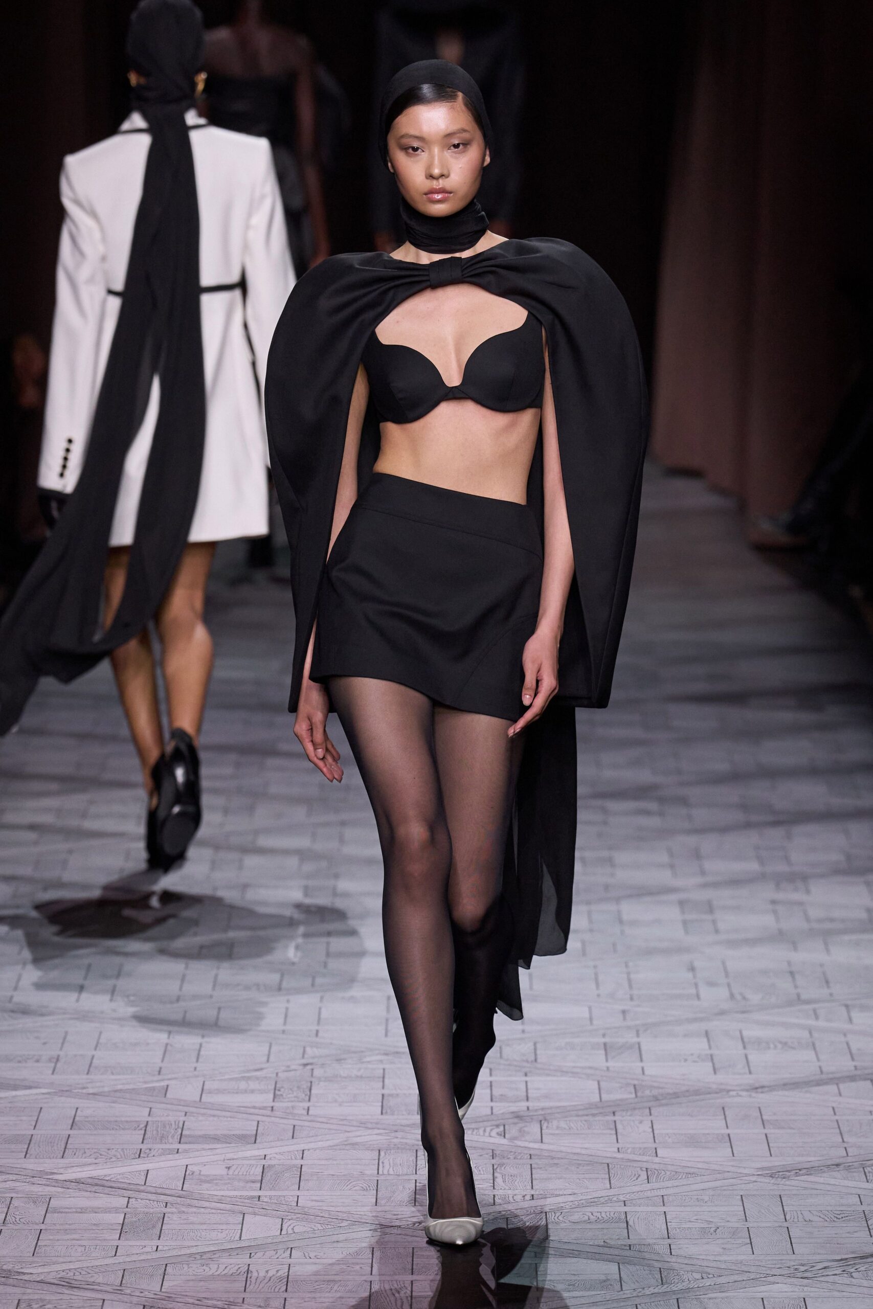 black silk top and mini skirt with cape