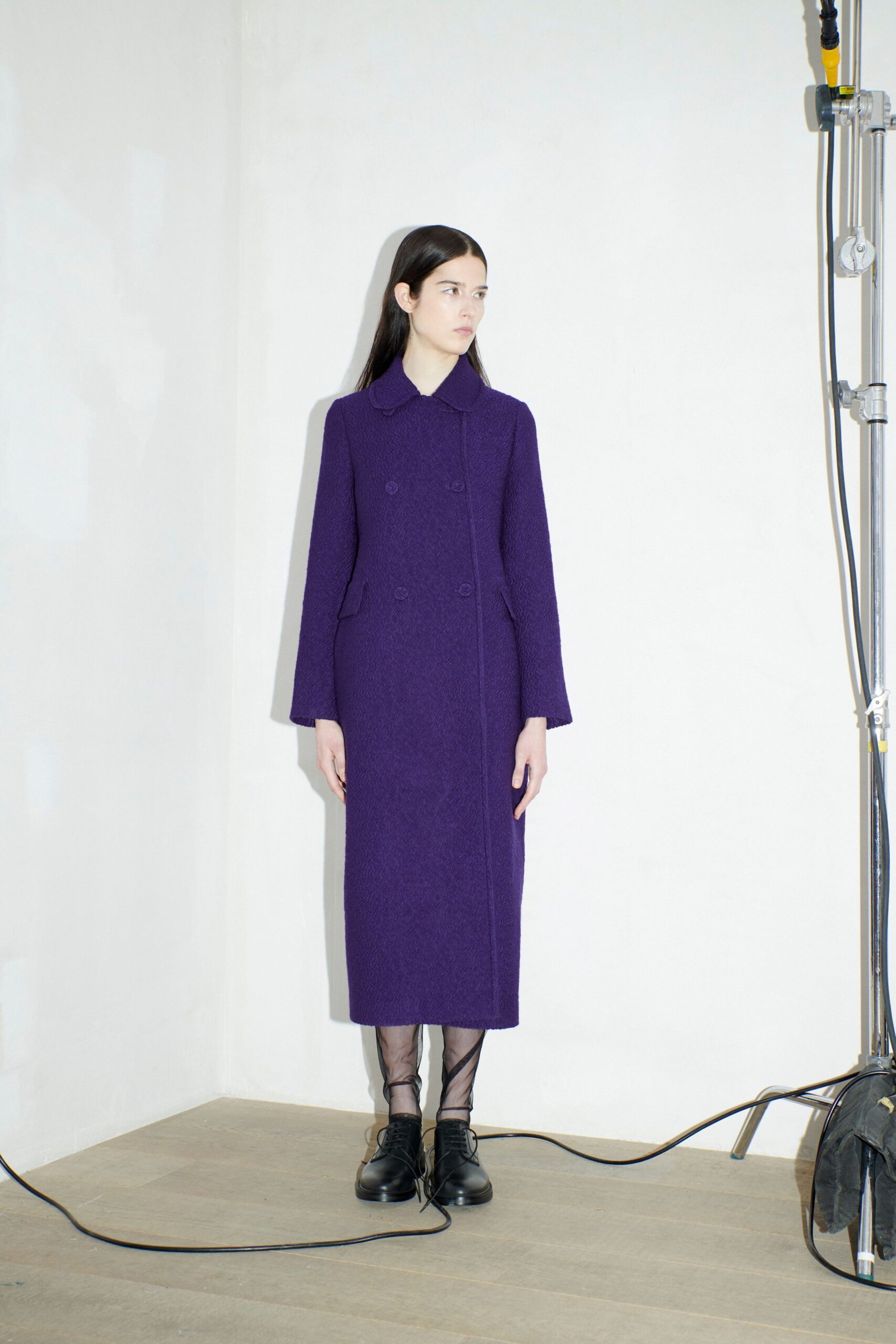 purple wool fitted coat with black shoes