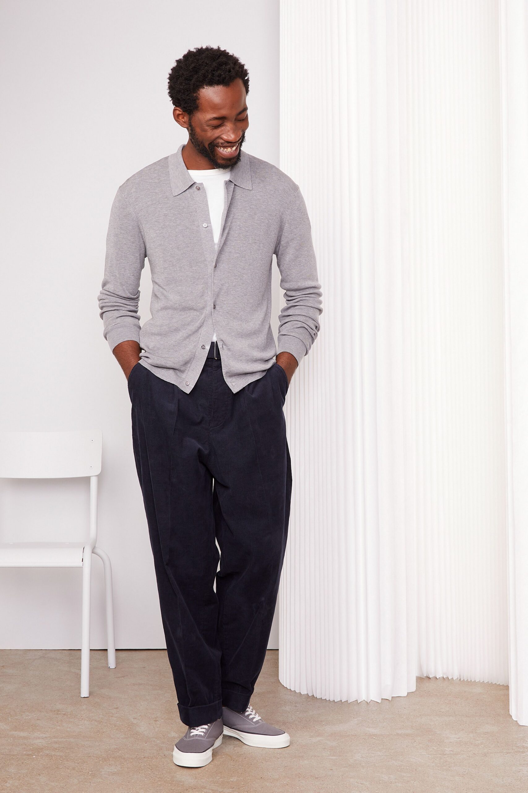 gray cardigan white shirt black pants