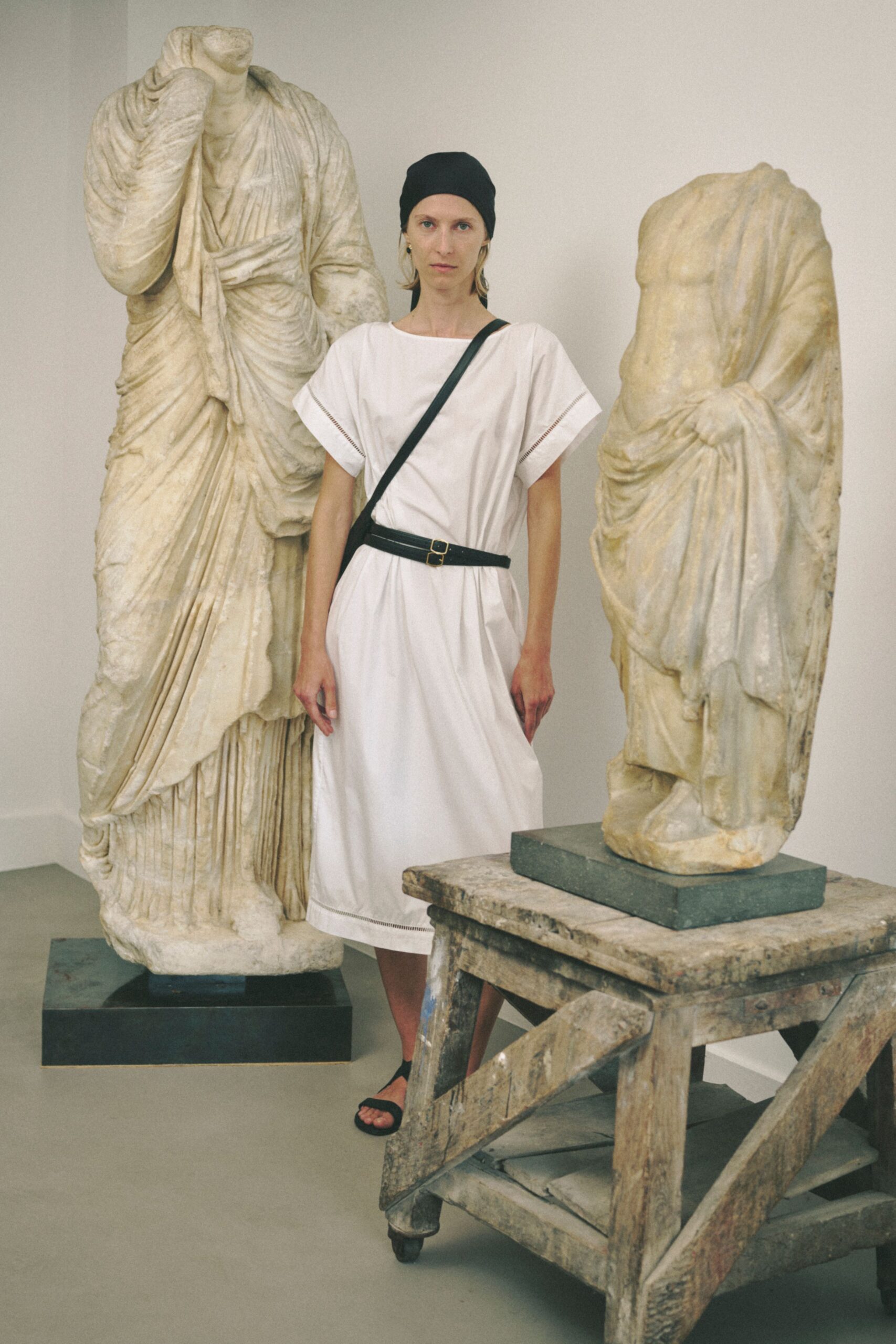 white relaxed midi dress with black accessories