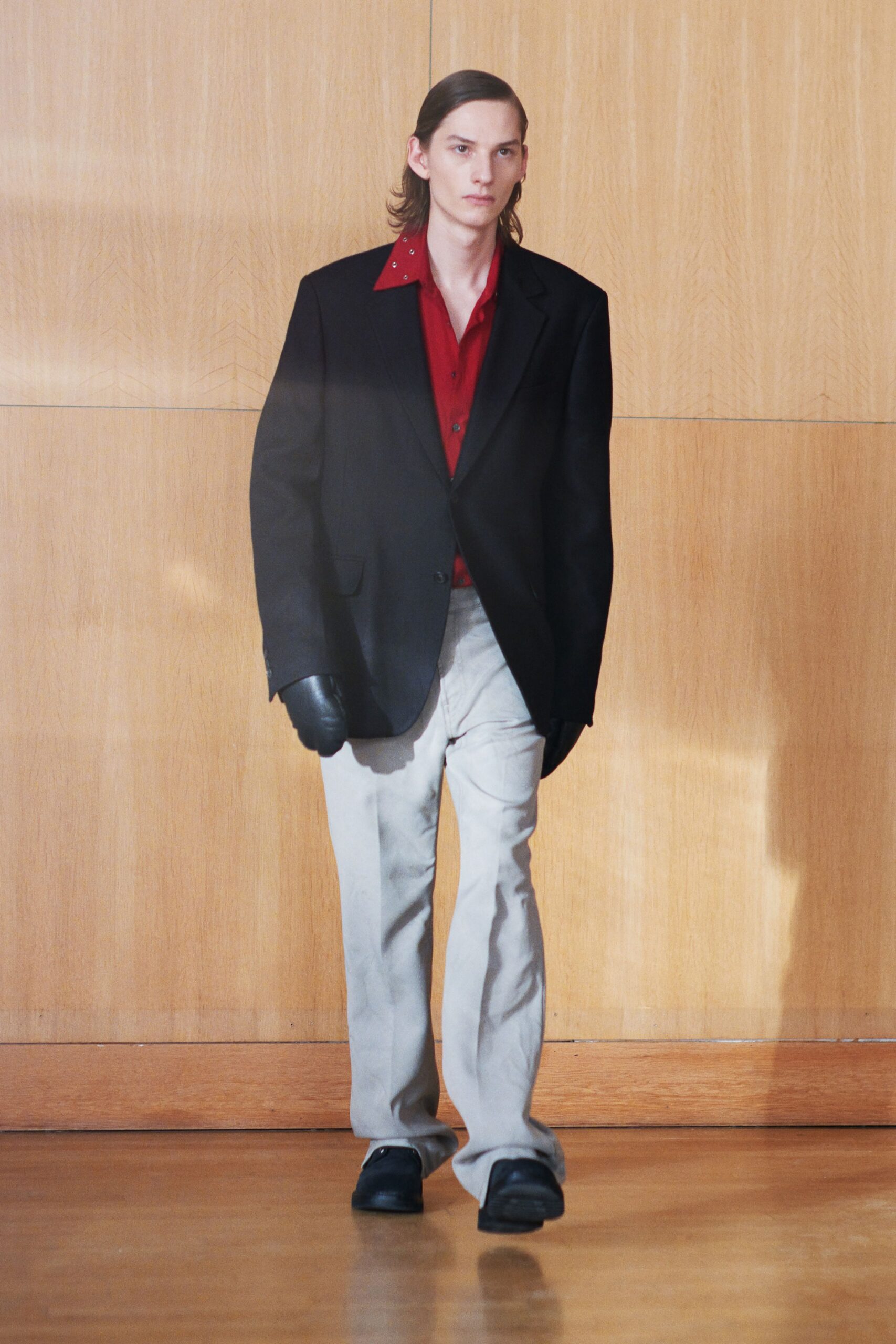 black blazer red shirt gray pants