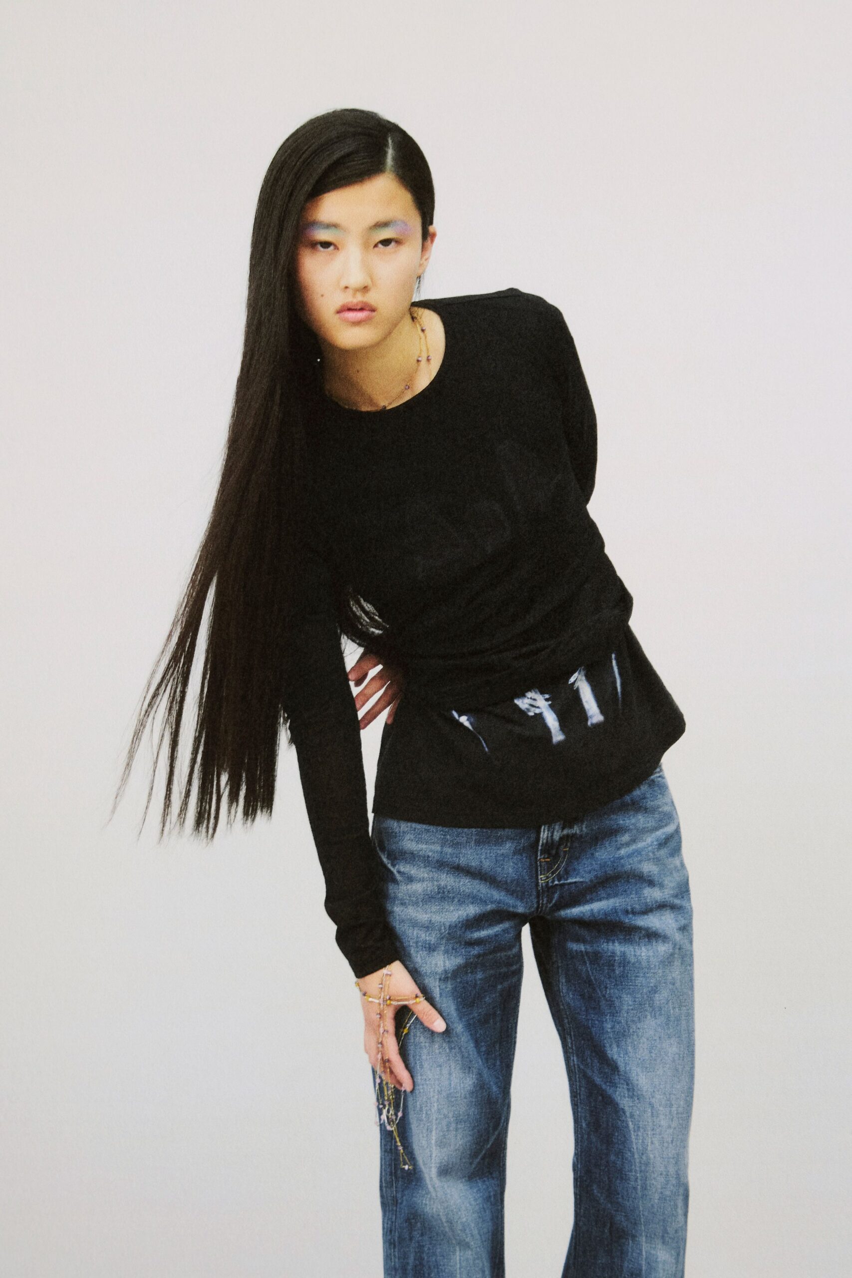 black fitted top with blue jeans