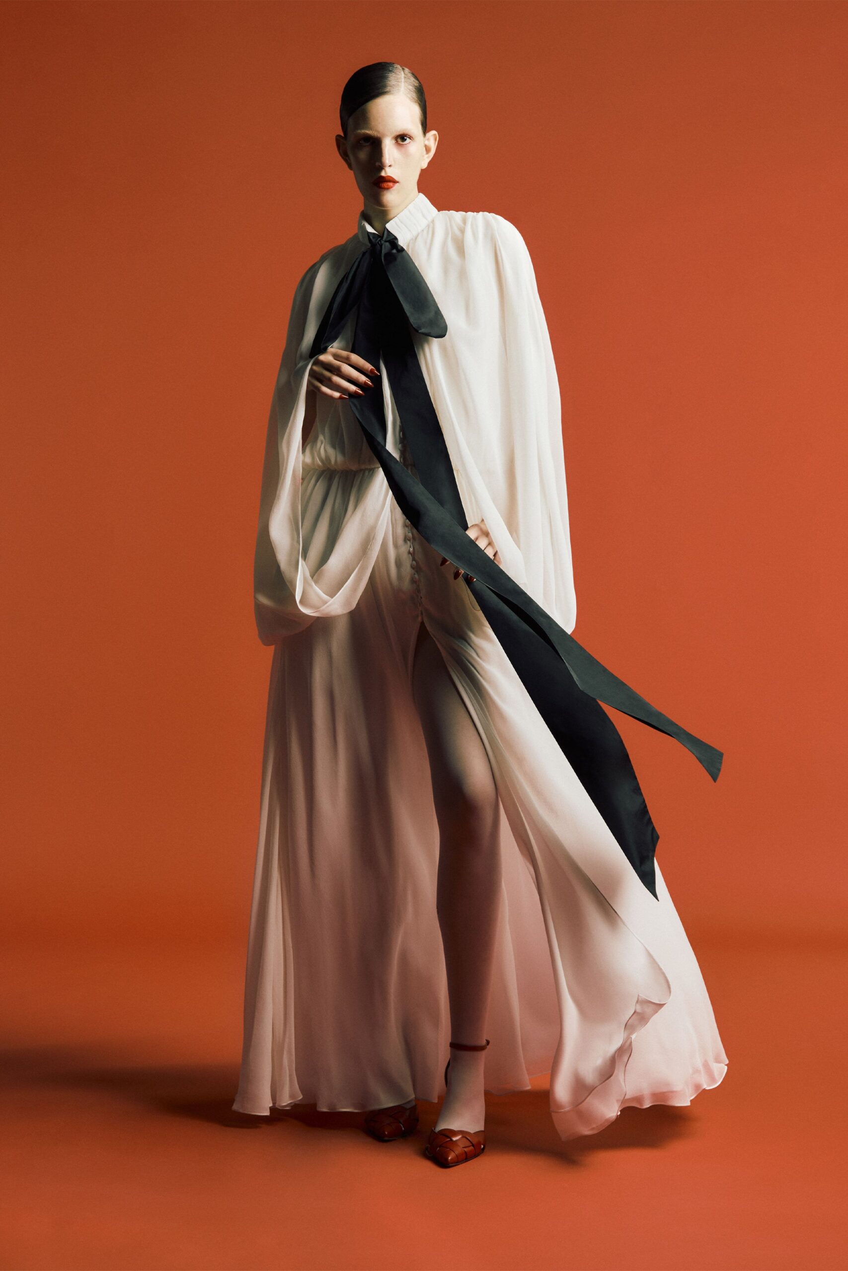 white silk long-sleeve collared fitted layered pleated gown
