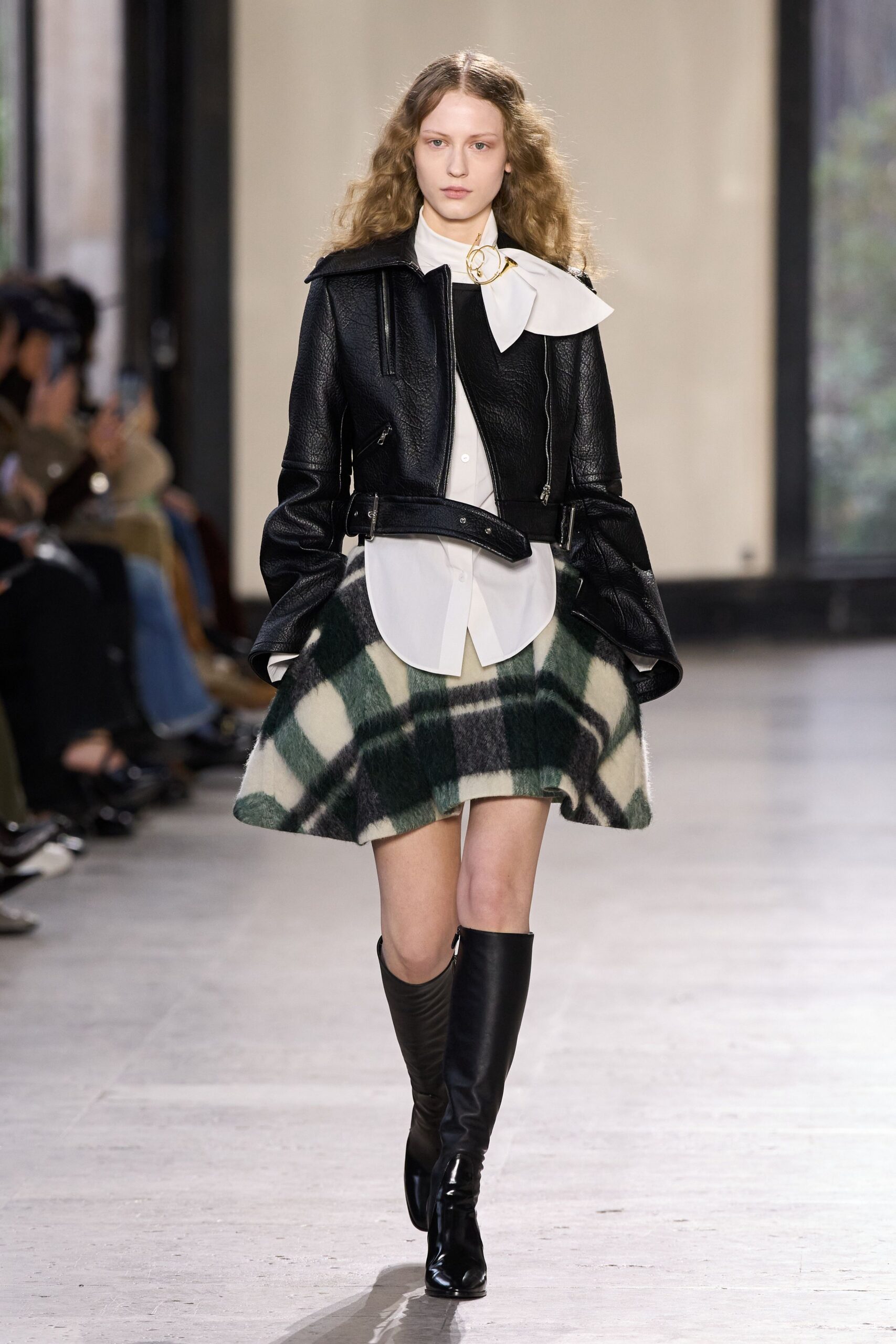 black leather jacket with plaid skirt