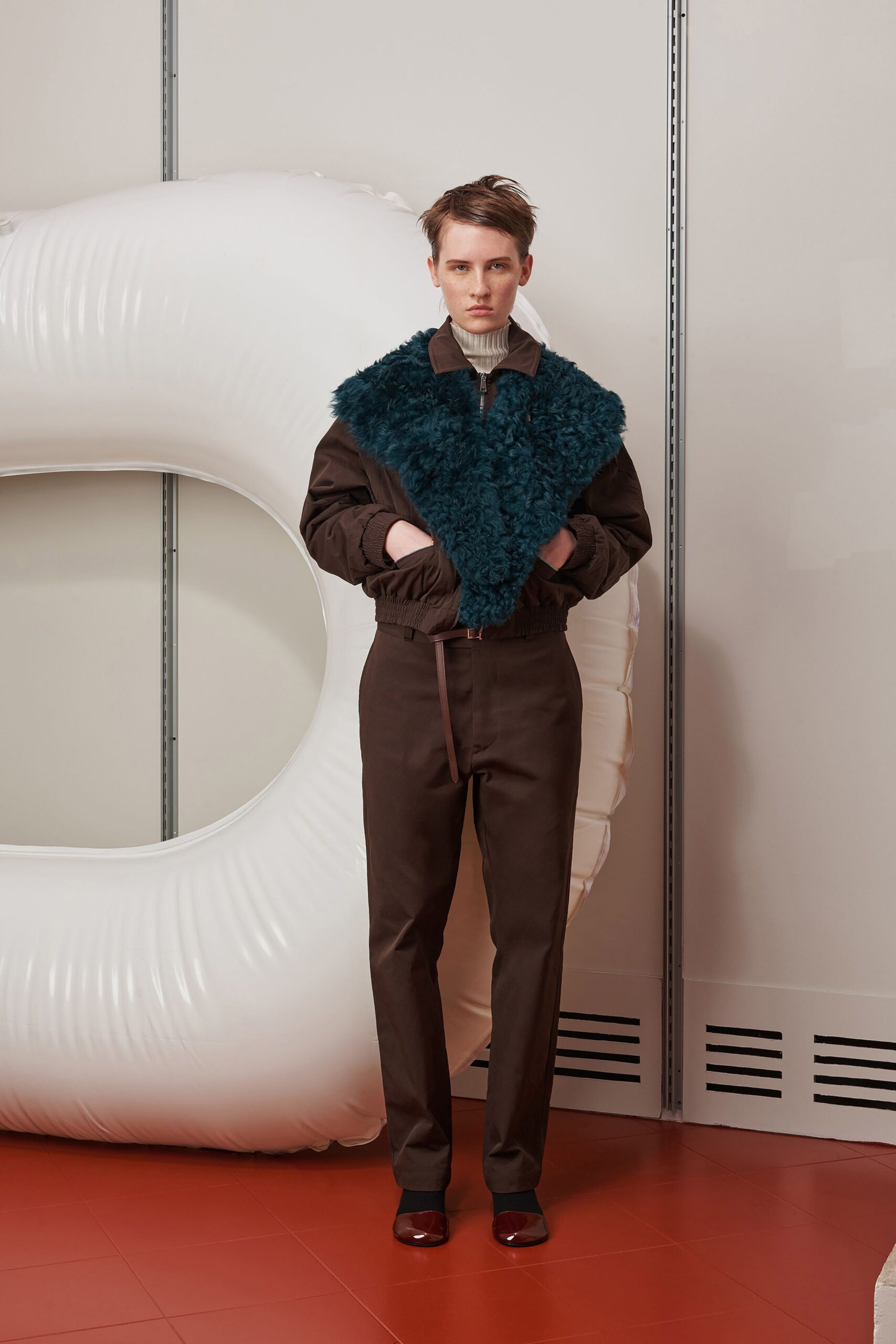 brown faux-fur jacket with tailored pants