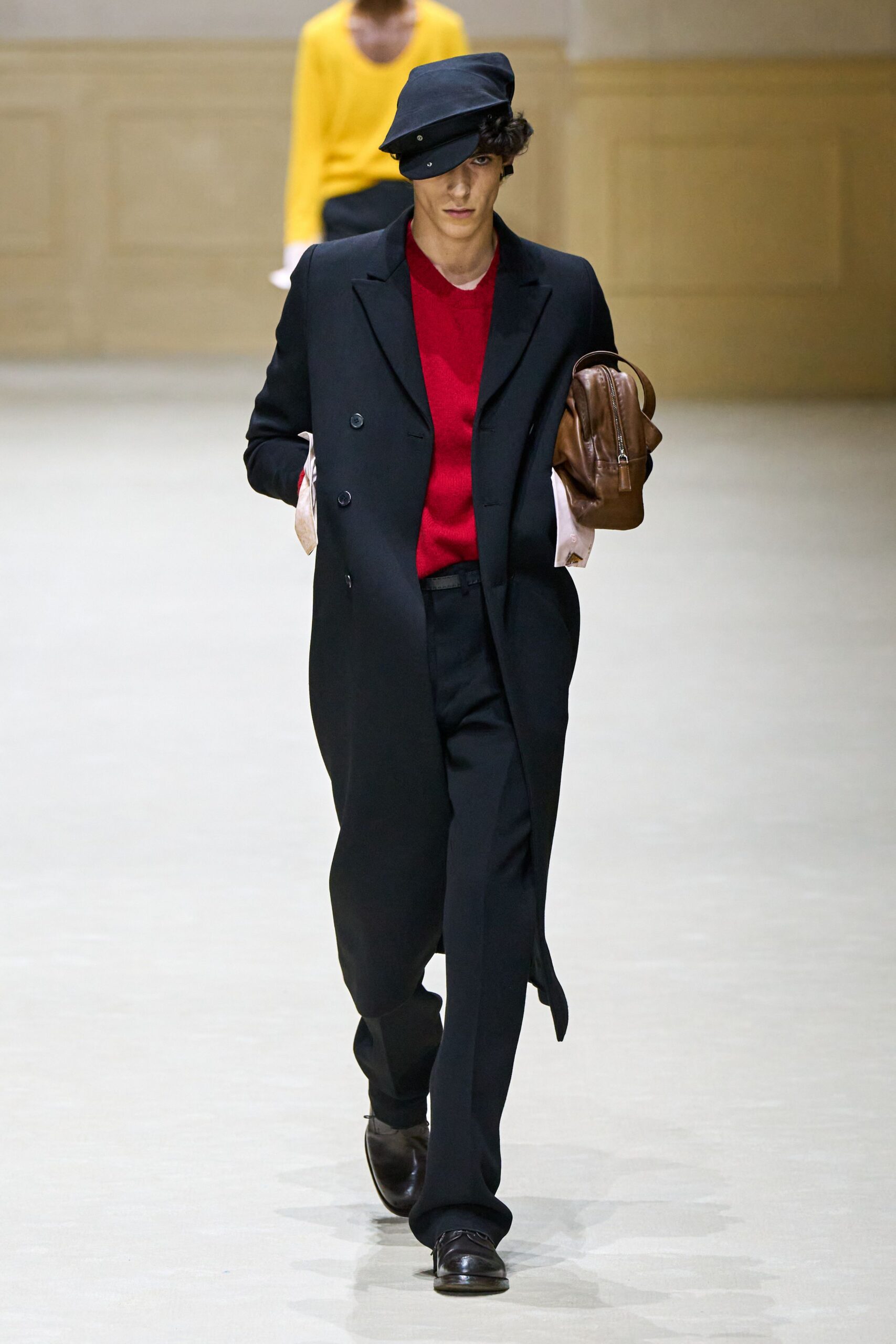 black coat red top tailored pants