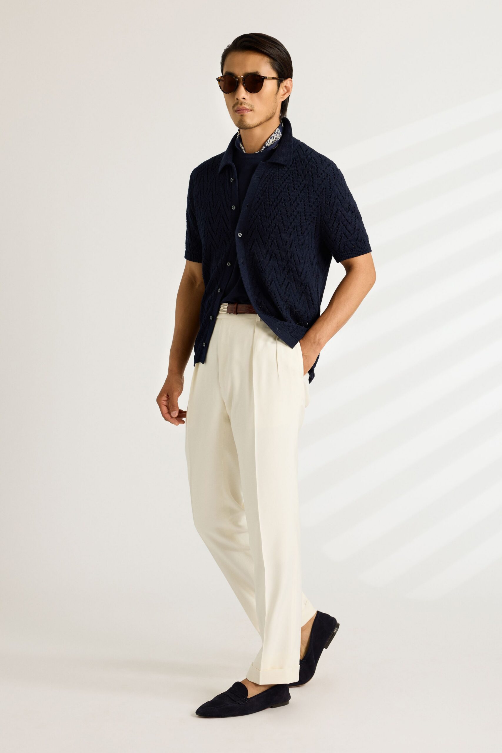 blue short-sleeve shirt with white pants
