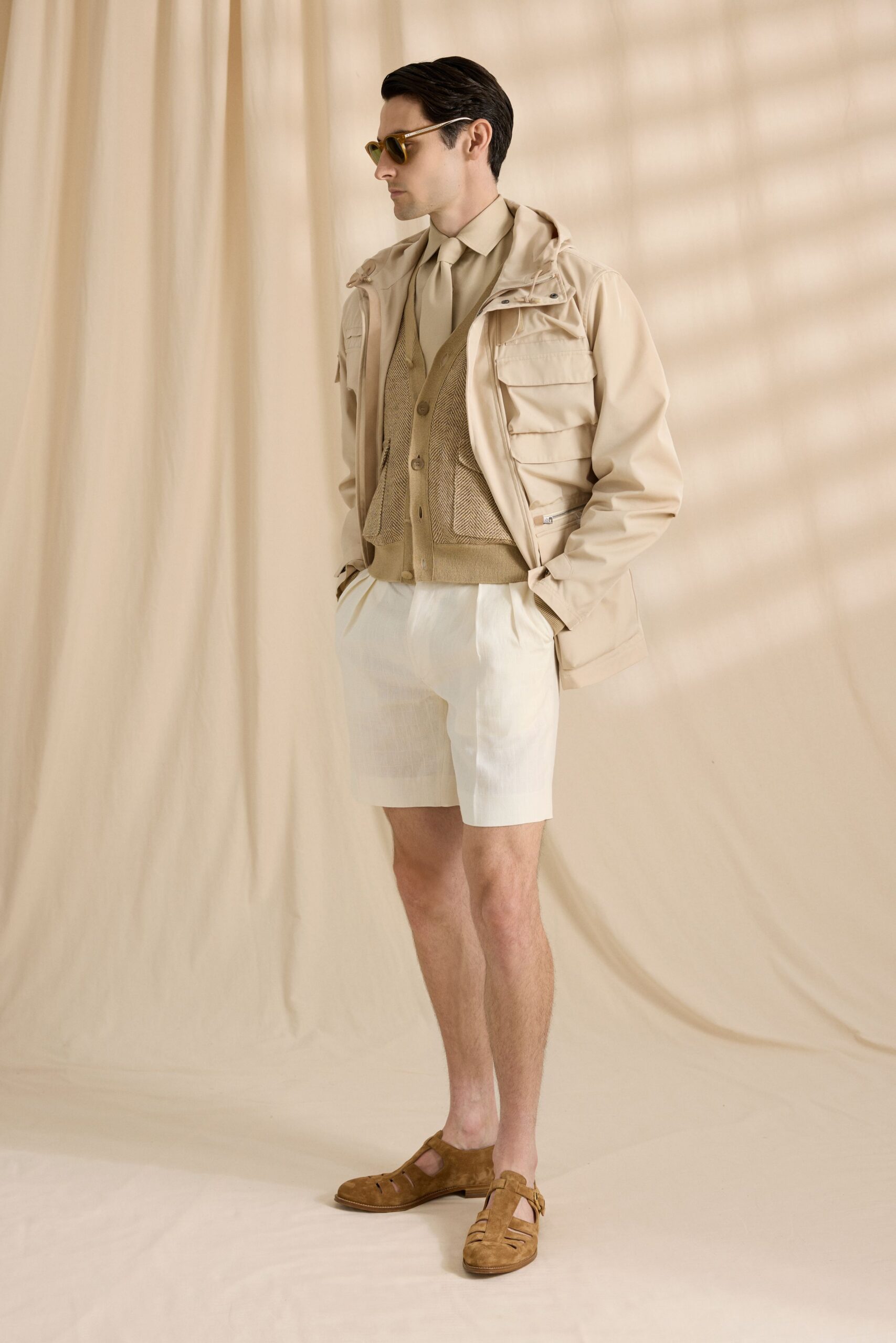 beige jacket brown vest white shirt