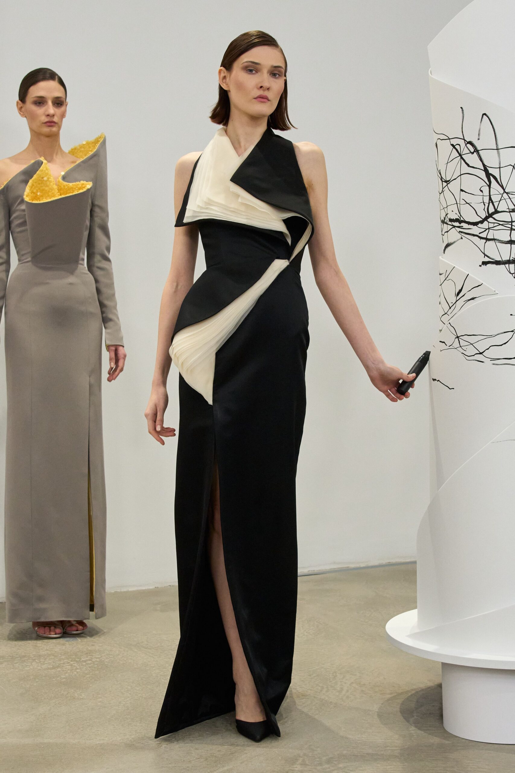black and white draped gown