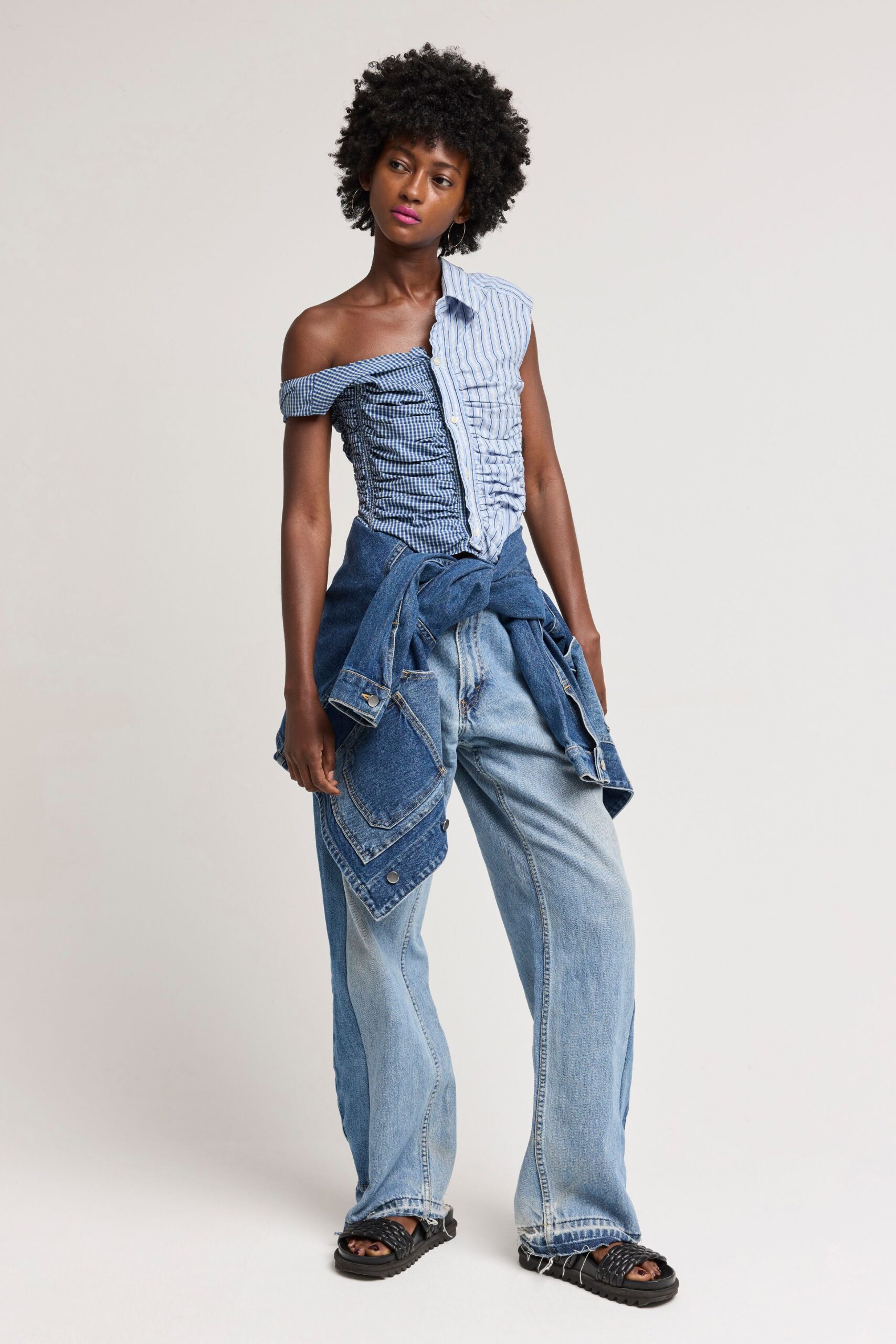 blue and white fitted top with relaxed denim pants