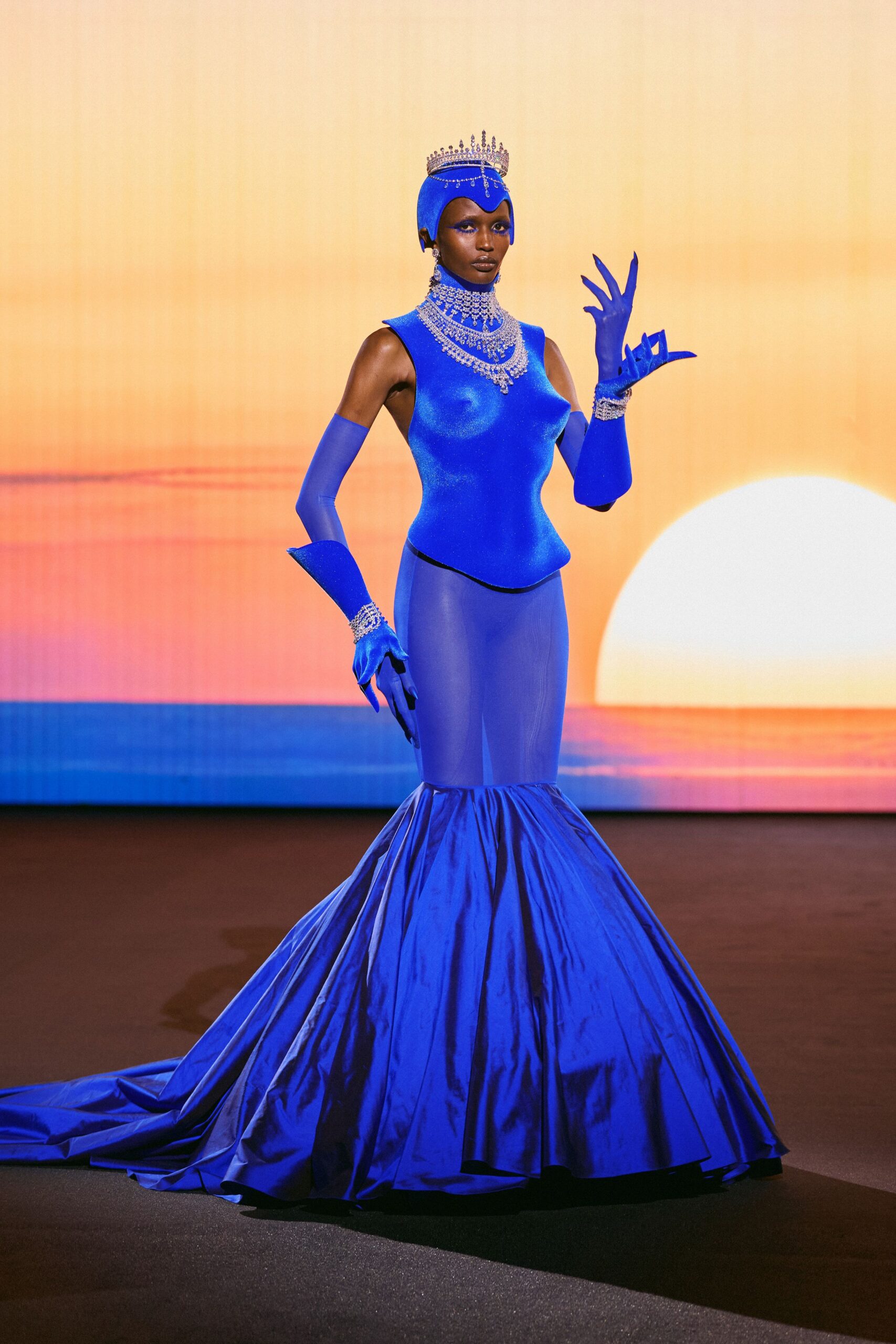 blue satin sleeveless high-neck fitted flared shiny gown