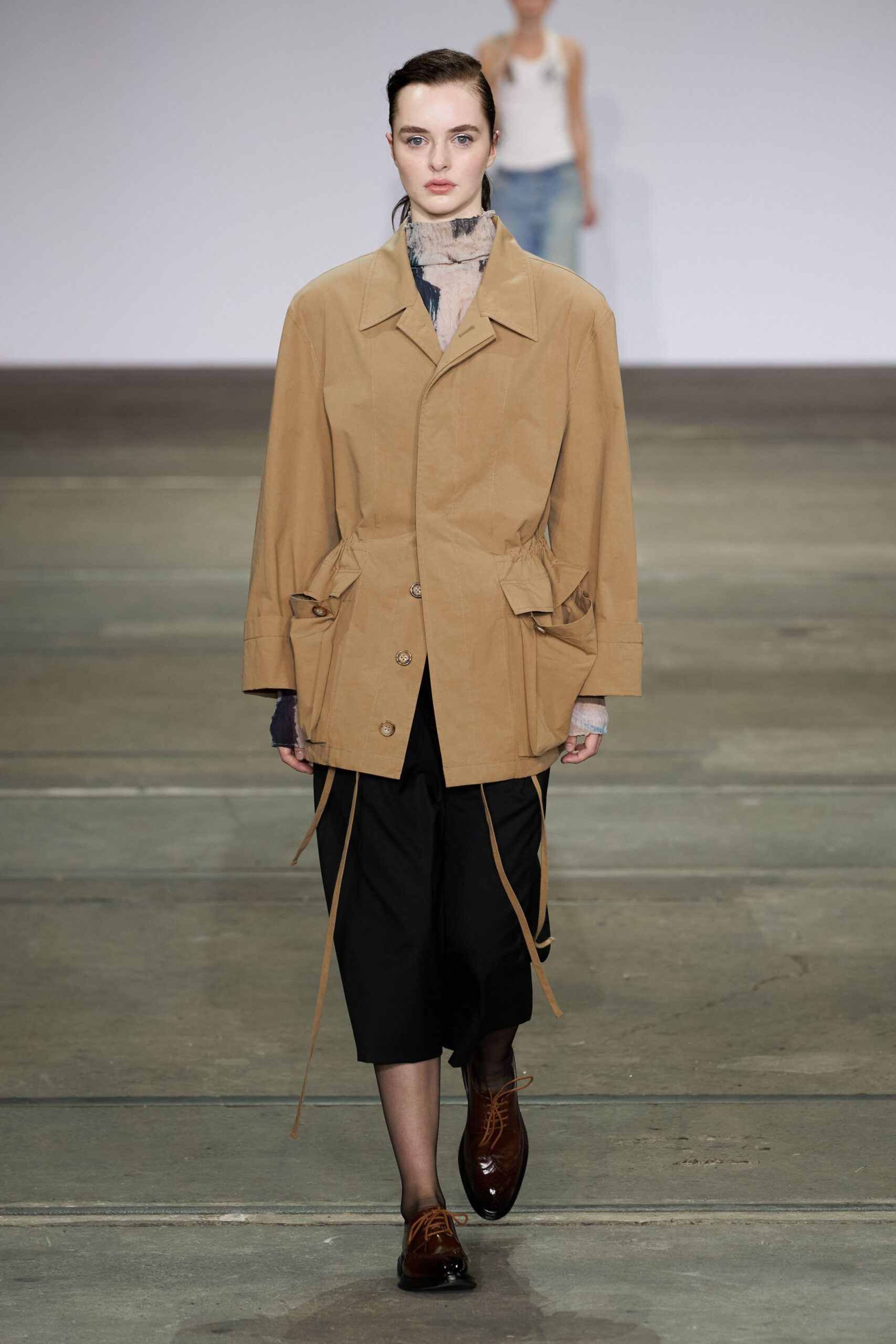beige relaxed jacket with black pants