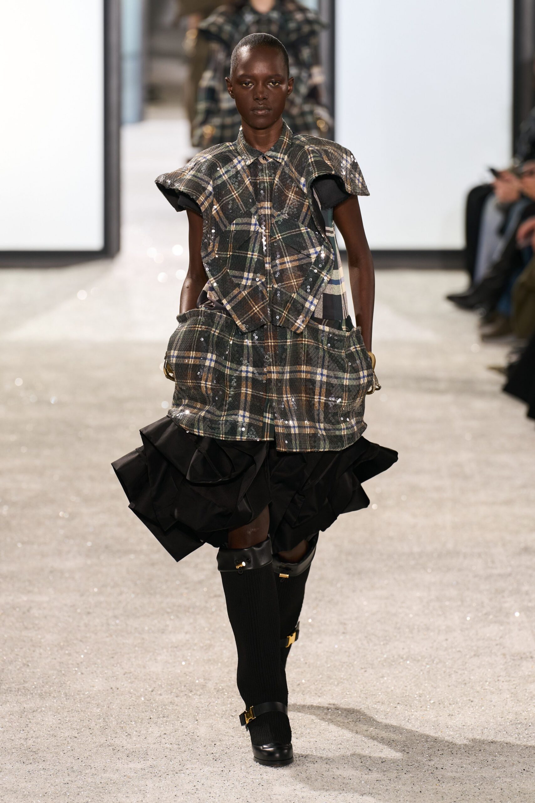 black and green layered mini dress with boots