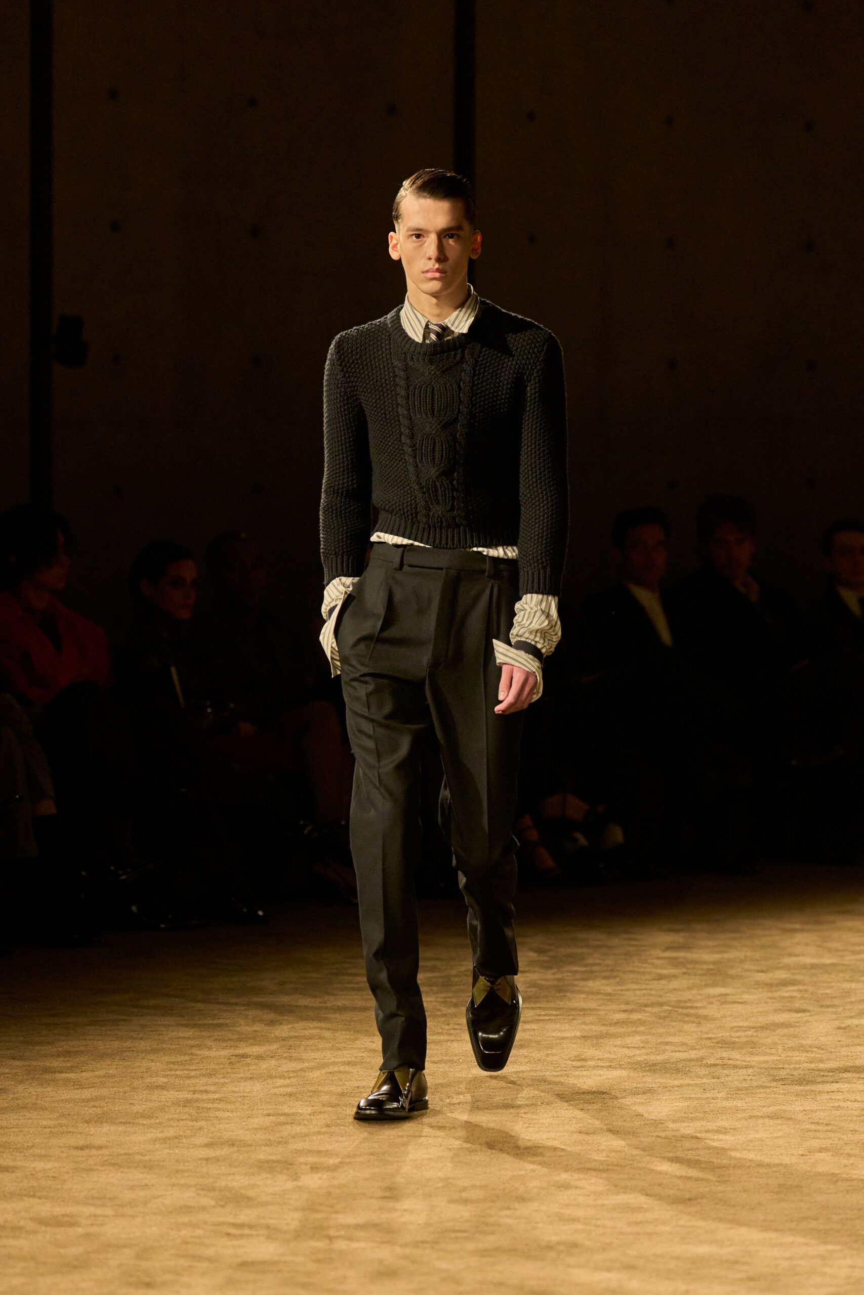 black fitted sweater and tailored pants