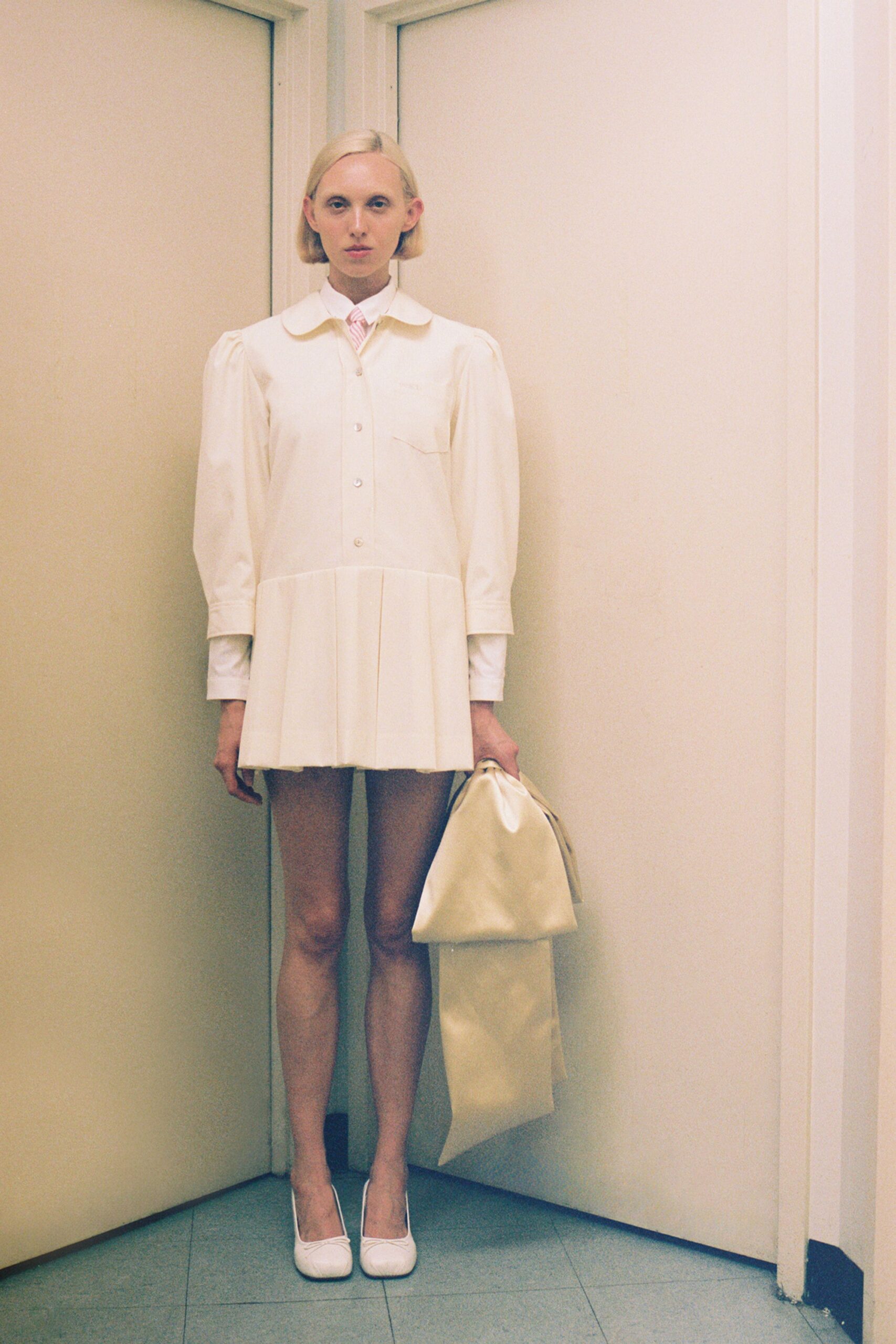 white cotton long-sleeve collared fitted pleated mini dress