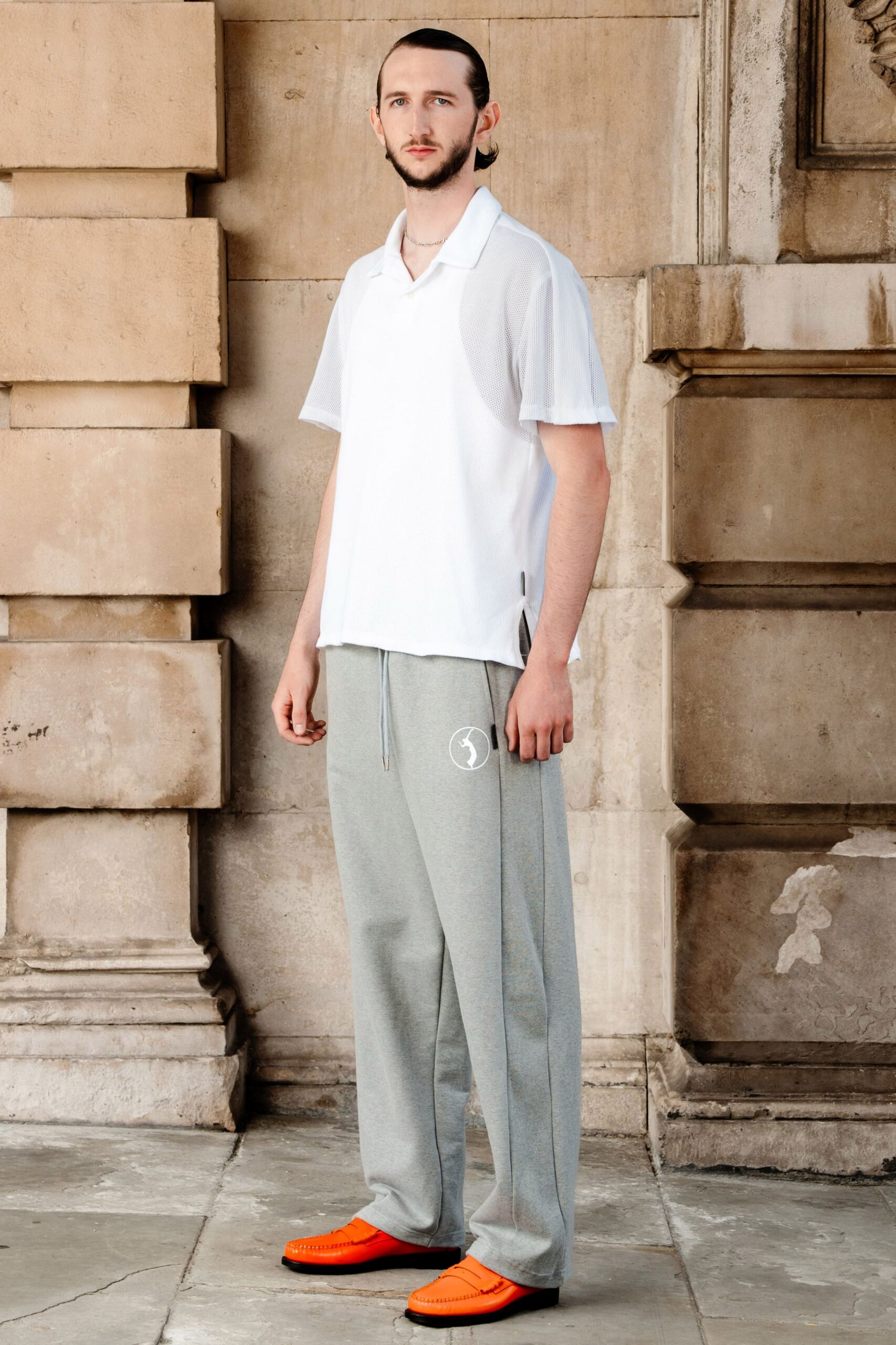 white shirt gray pants orange shoes