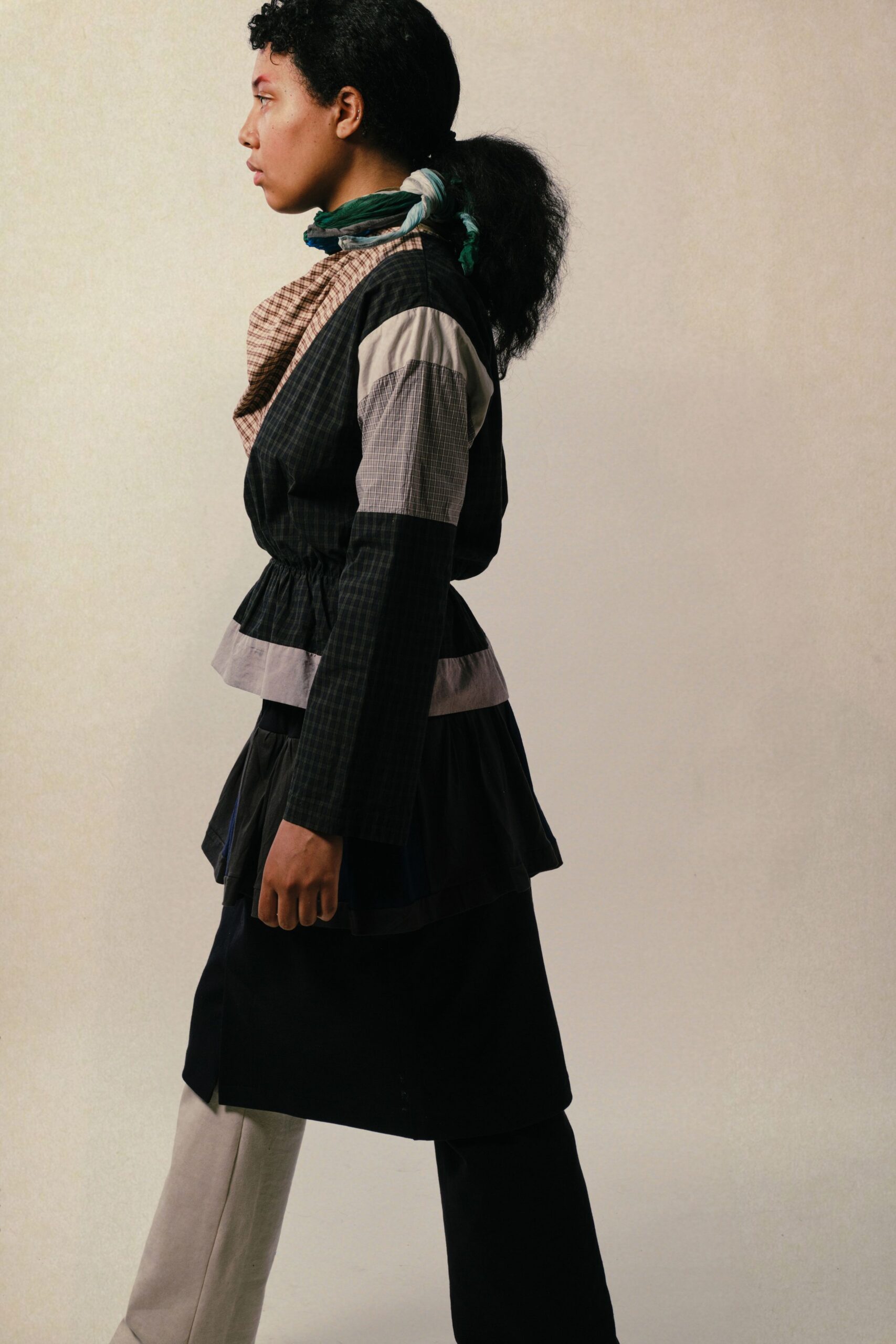 black cotton long-sleeve collared fitted layered pleated top