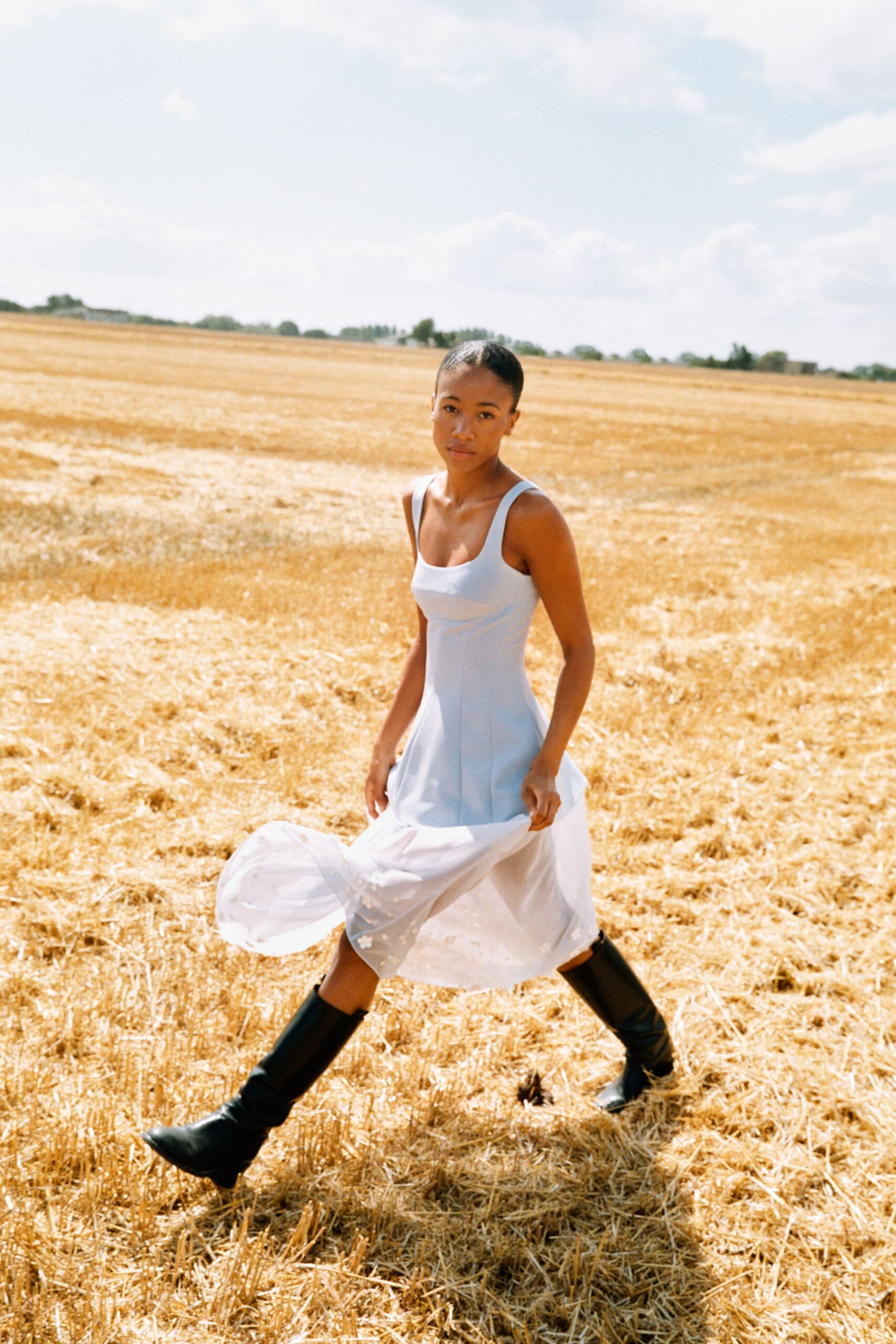 white blue tiered midi dress with black boots