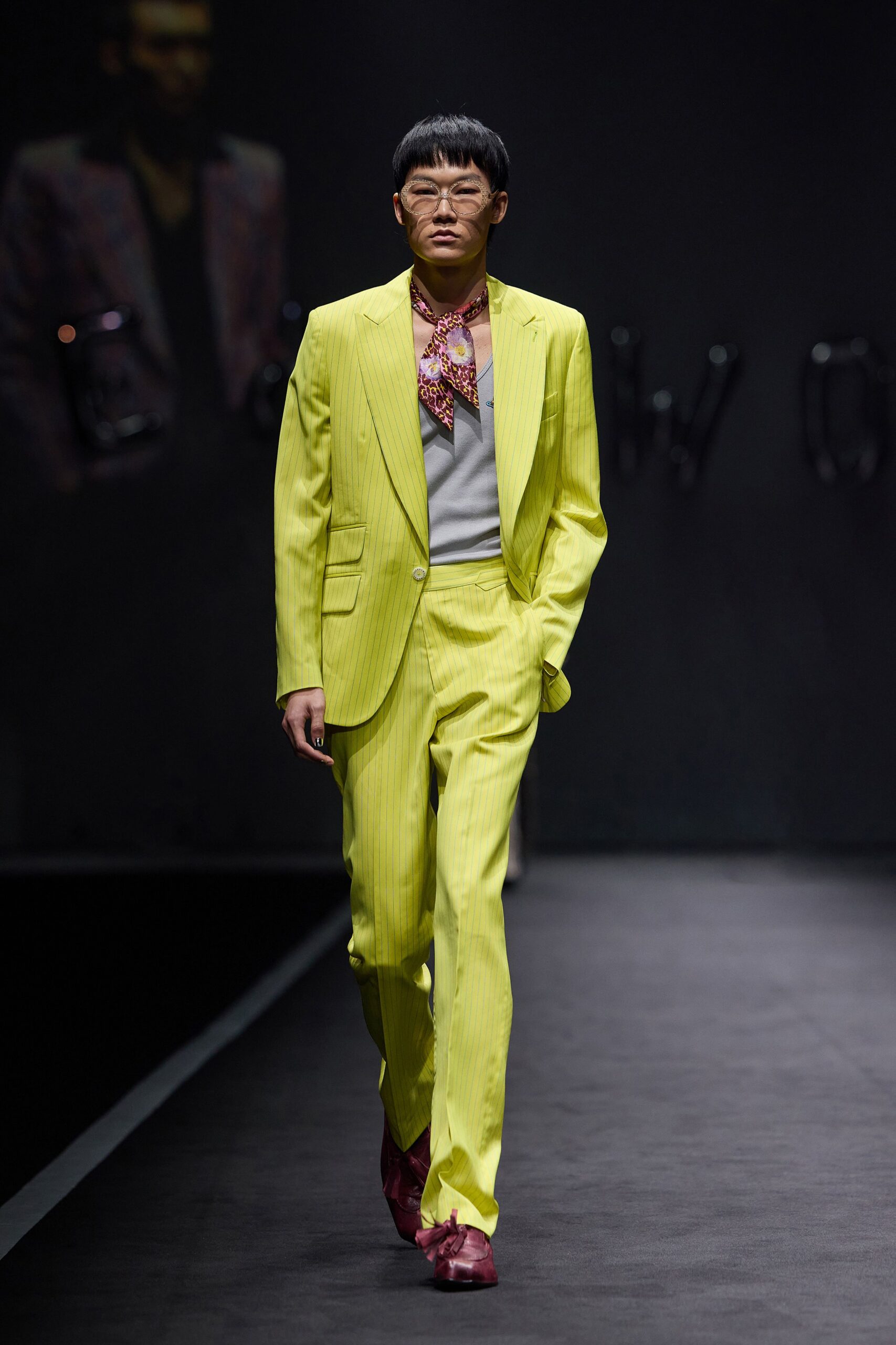 yellow tailored suit with red scarf