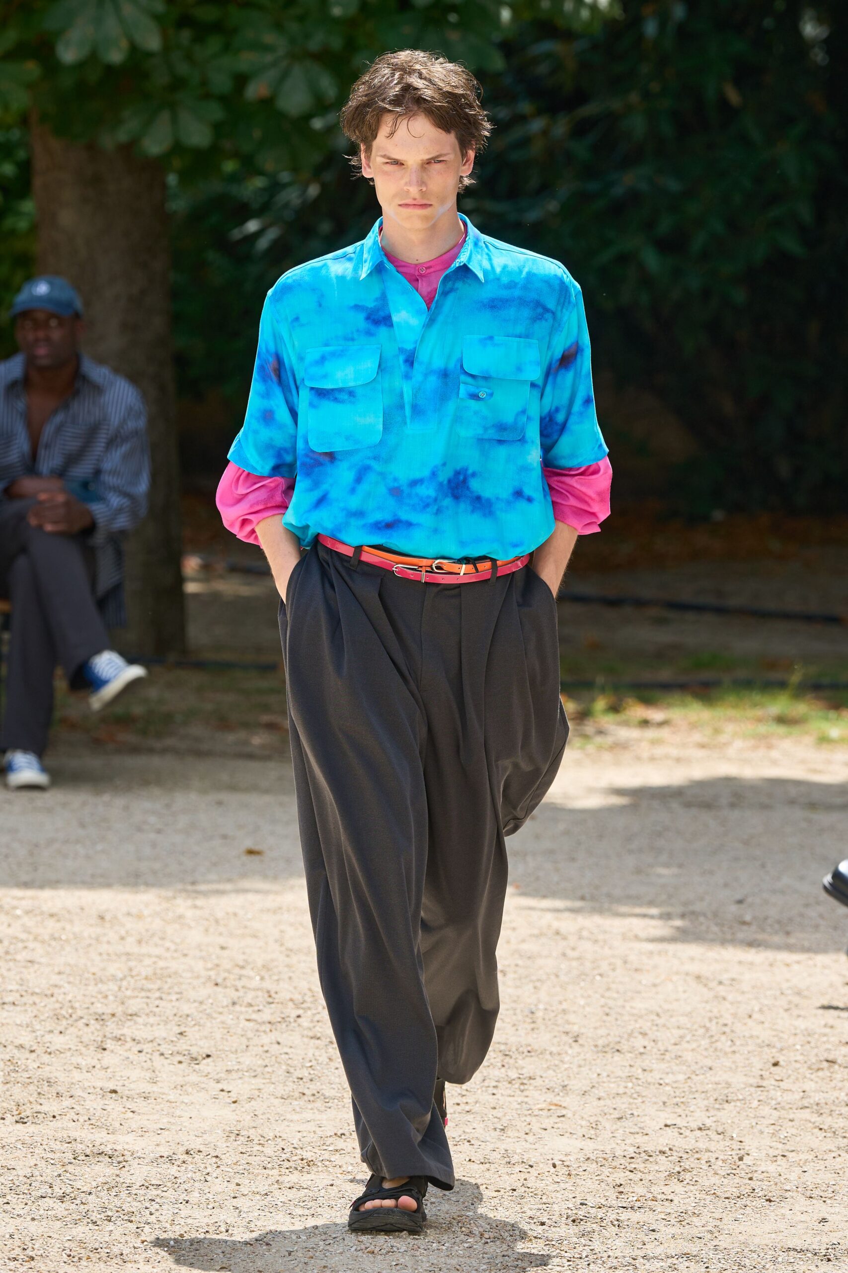 blue tie-dye shirt with black pants