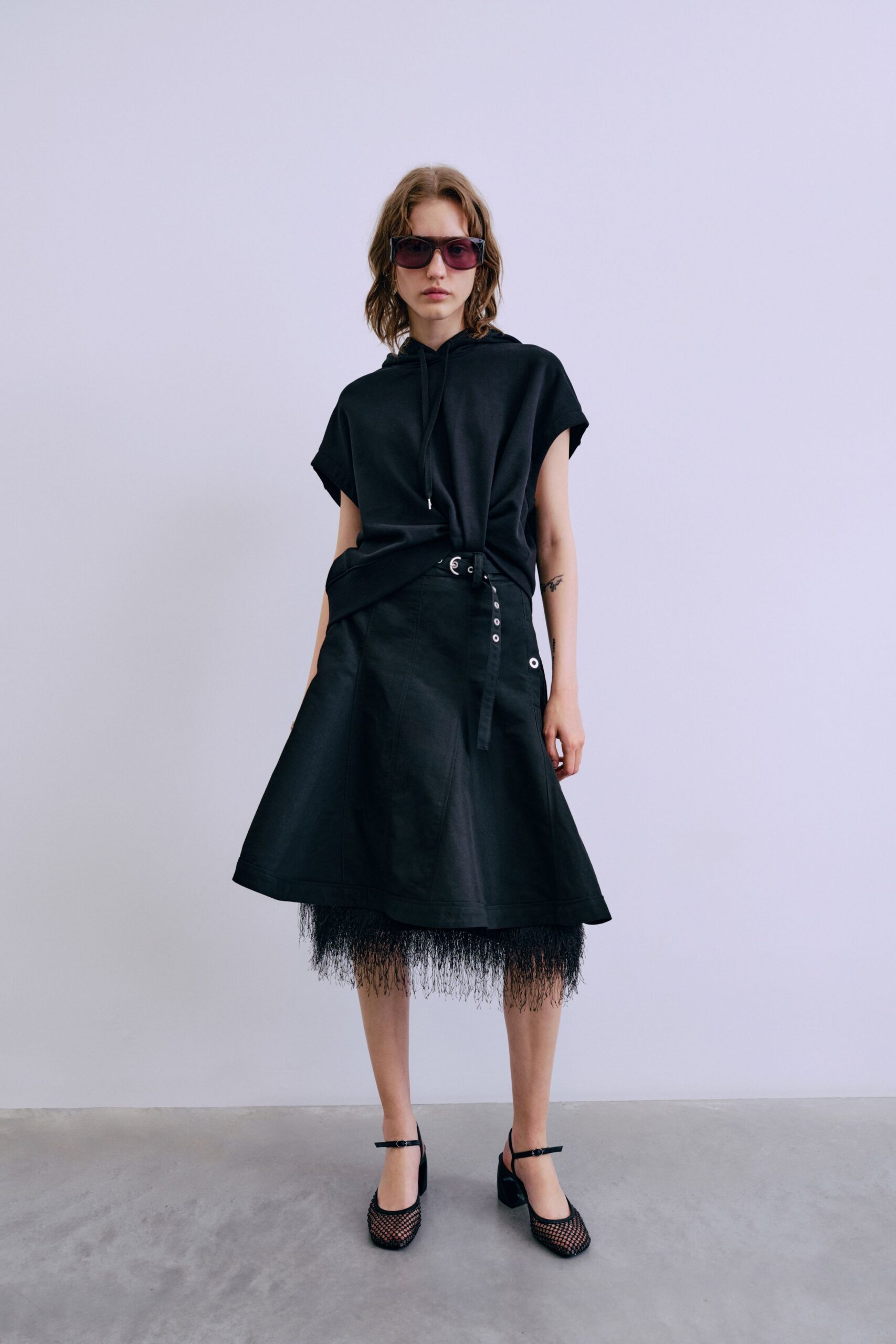 black relaxed top with flared skirt