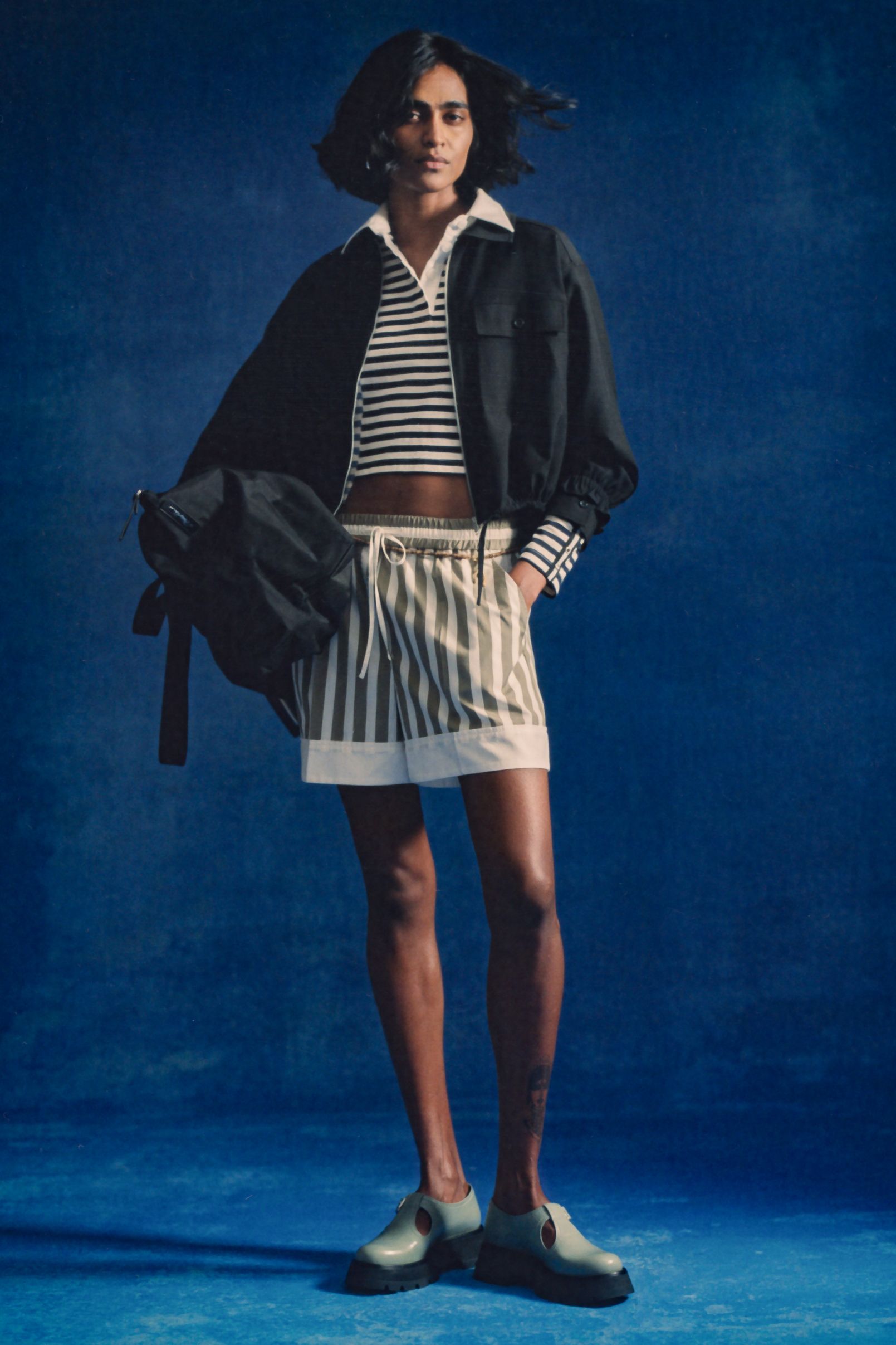 black jacket white striped top