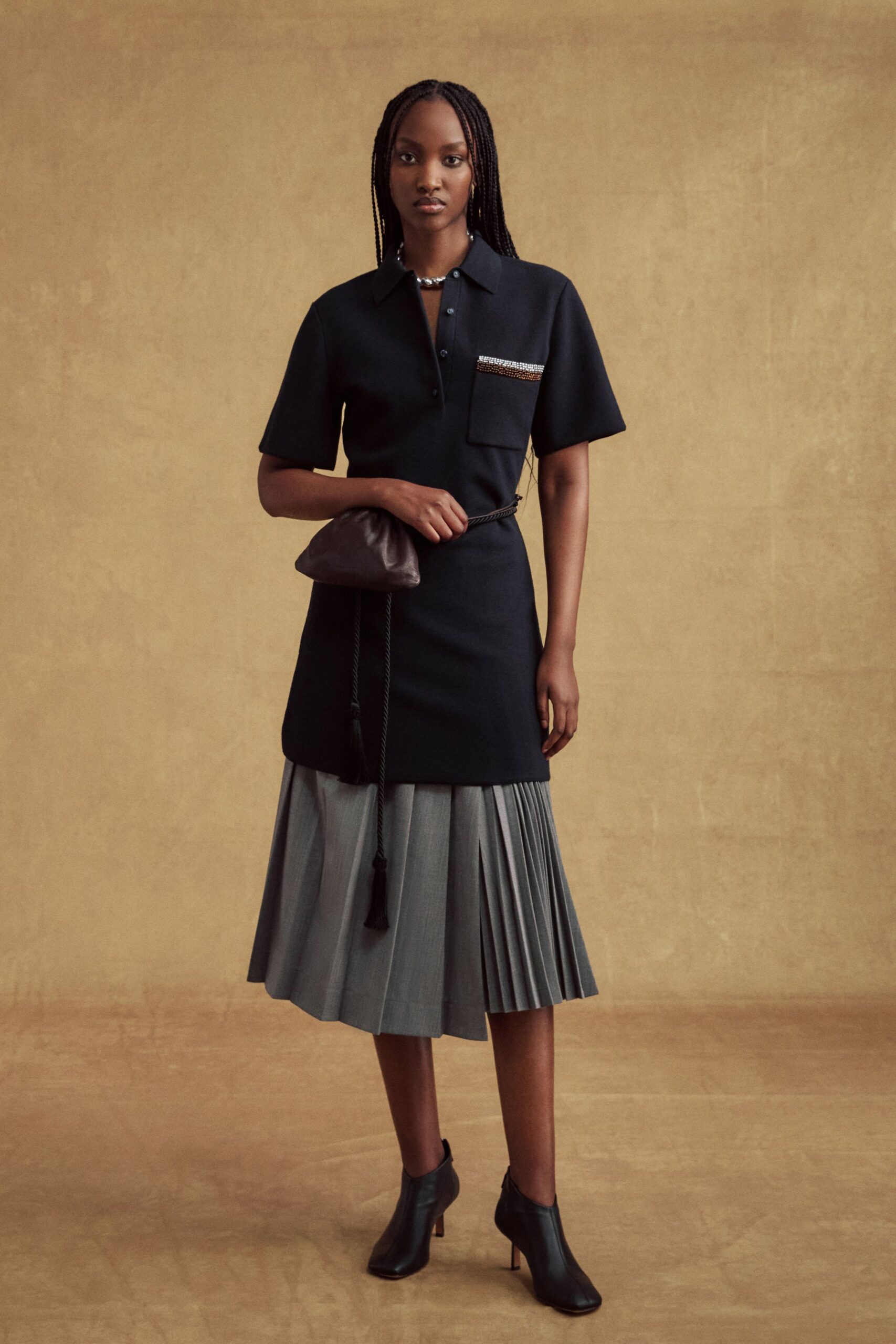 black shirt-dress with pleated skirt